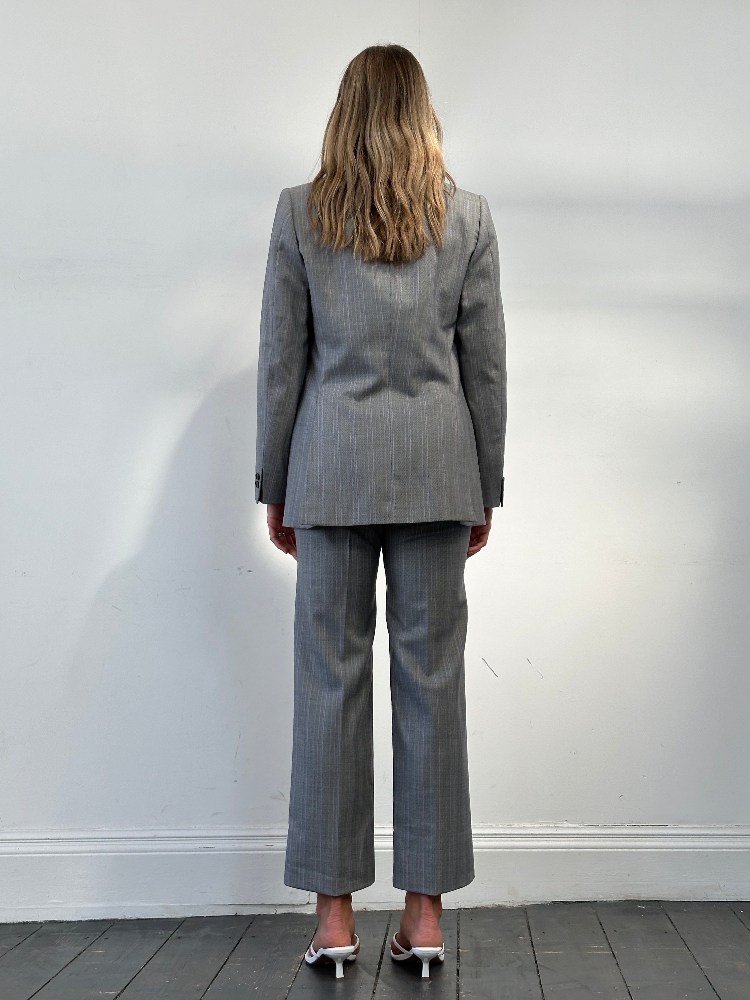 Vintage Italian vintage pure wool stripe double-breasted suit, size 36R/W28, featuring classic tailored design and bold stripe pattern.
