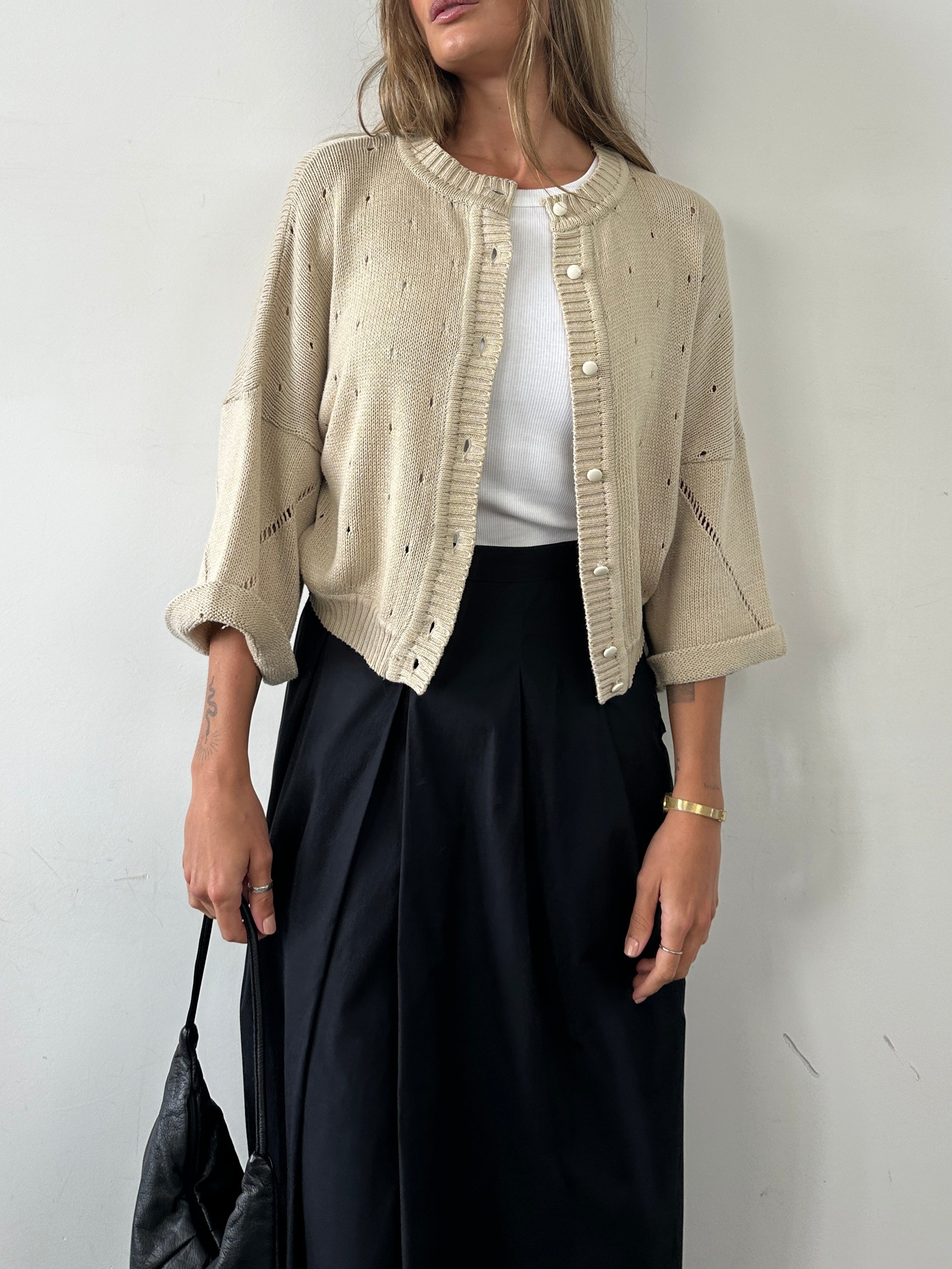 Vintage Italian vintage pure cotton cardigan in size M, featuring classic knit texture and button closure.