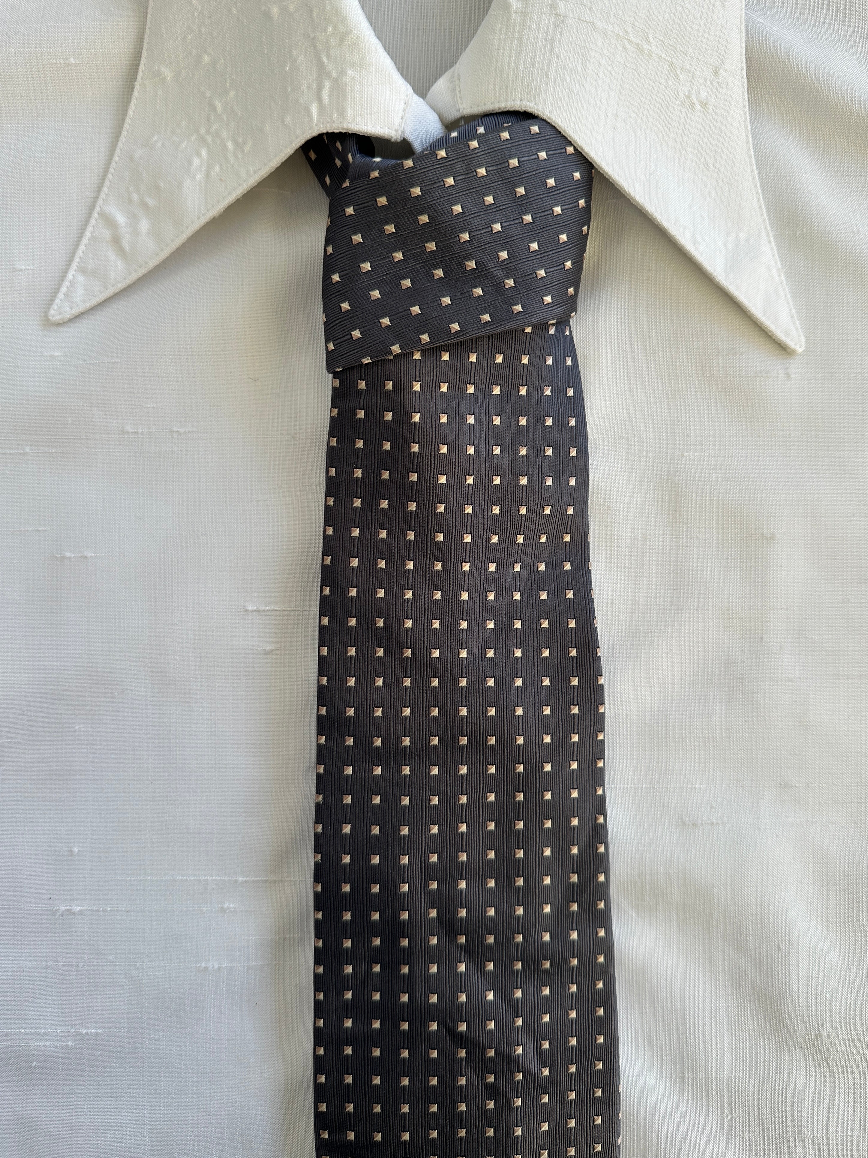 Vintage 1990s pure silk patterned tie featuring intricate geometric designs and rich colors, showcasing classic men's accessory style.