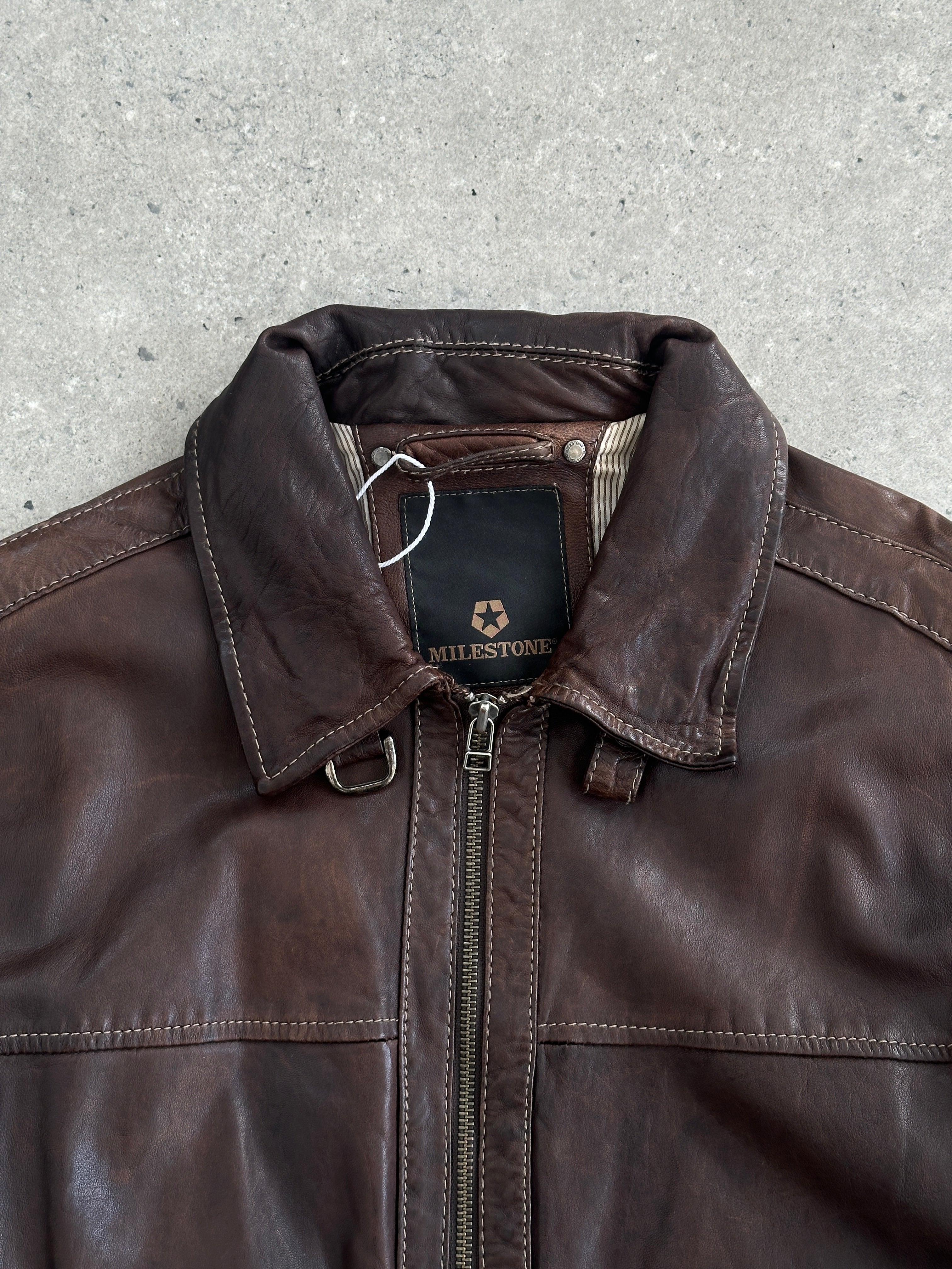Vintage Moto aged leather jacket in size large, featuring classic design and distressed leather texture.