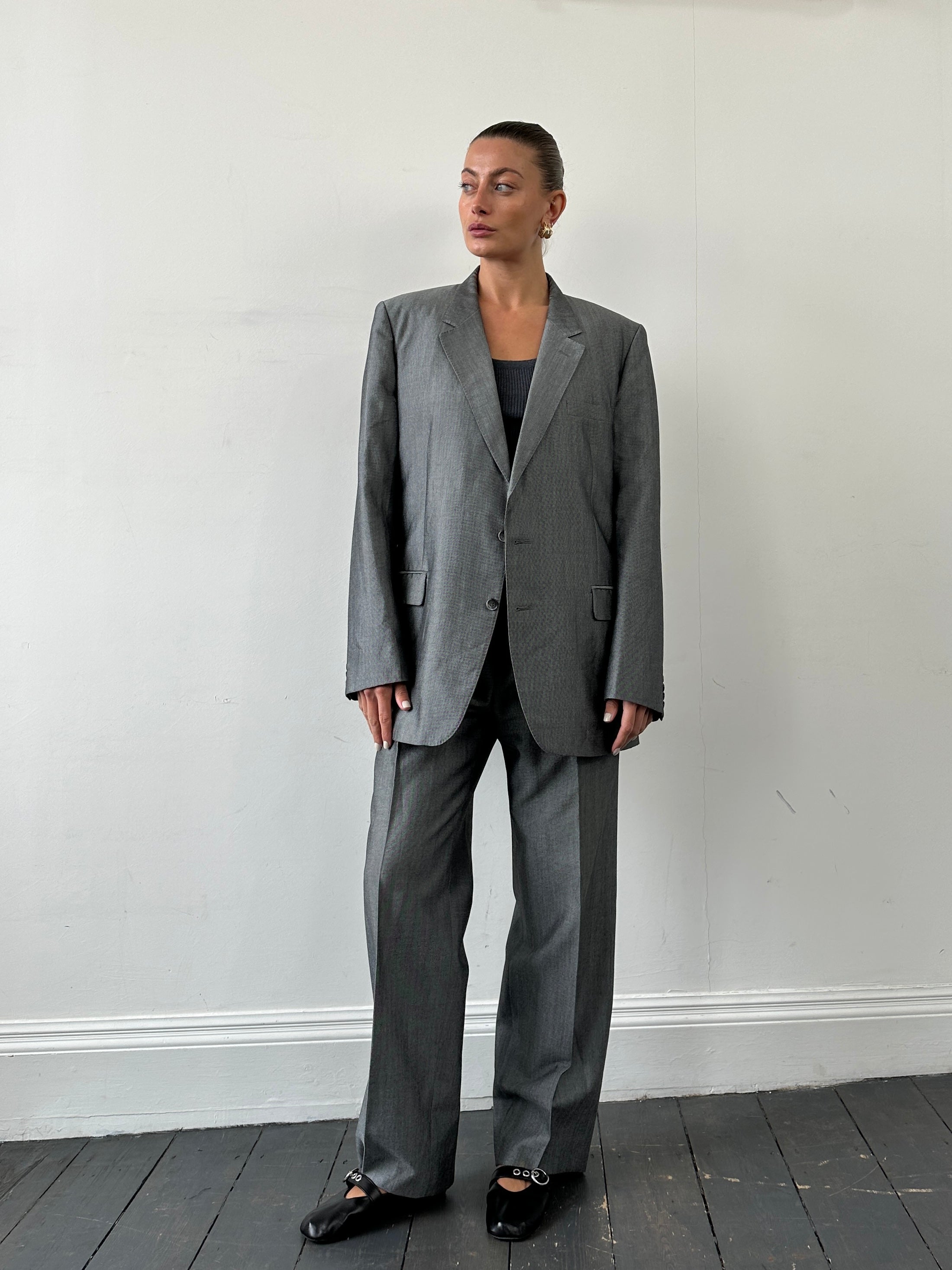 Christian Dior Monsieur wool single-breasted suit jumpsuit in size 44L/W36, shown in a tailored fit with lapel details.