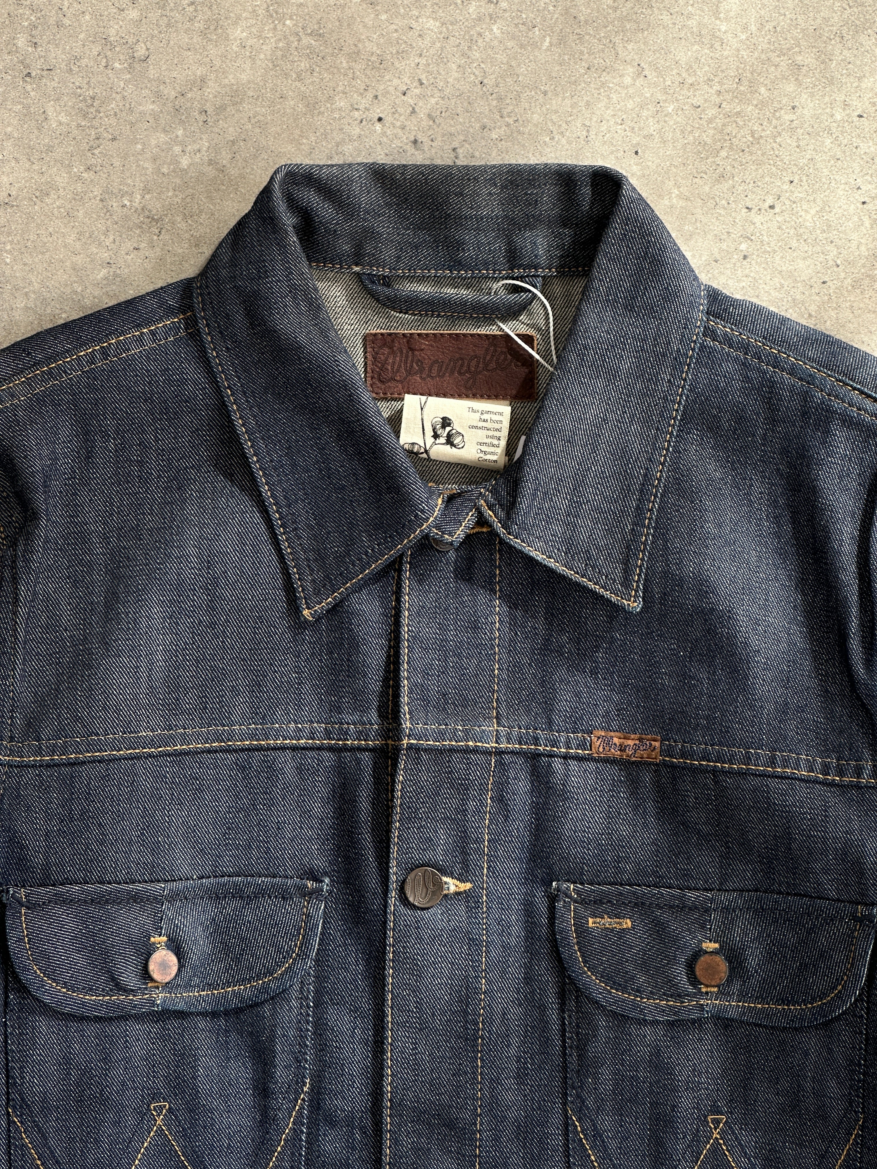 Wrangler organic cotton denim jacket in size small/medium, featuring classic style and durable construction.