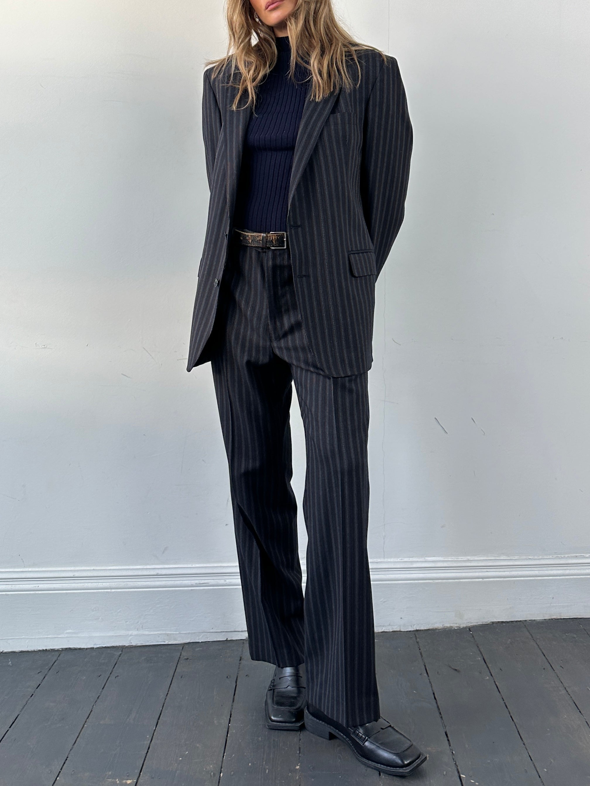 Christian Dior pure wool pinstripe jumpsuit in size 42L/W34, tailored fit with classic pinstripe pattern and elegant design.
