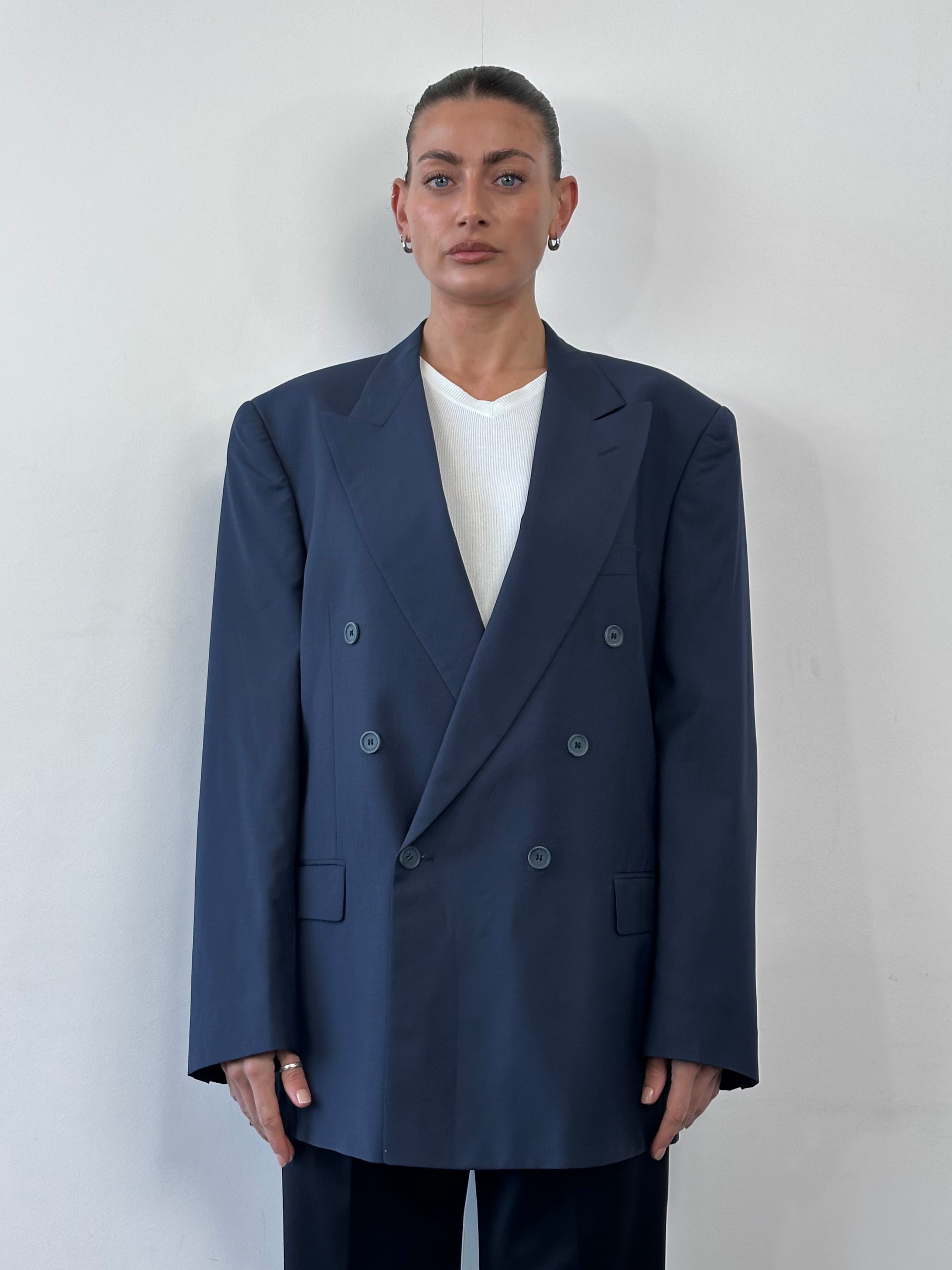 Vintage Italian 1990s double-breasted blazer made from pure Tasmanian wool, size 42R/XL, in classic style.