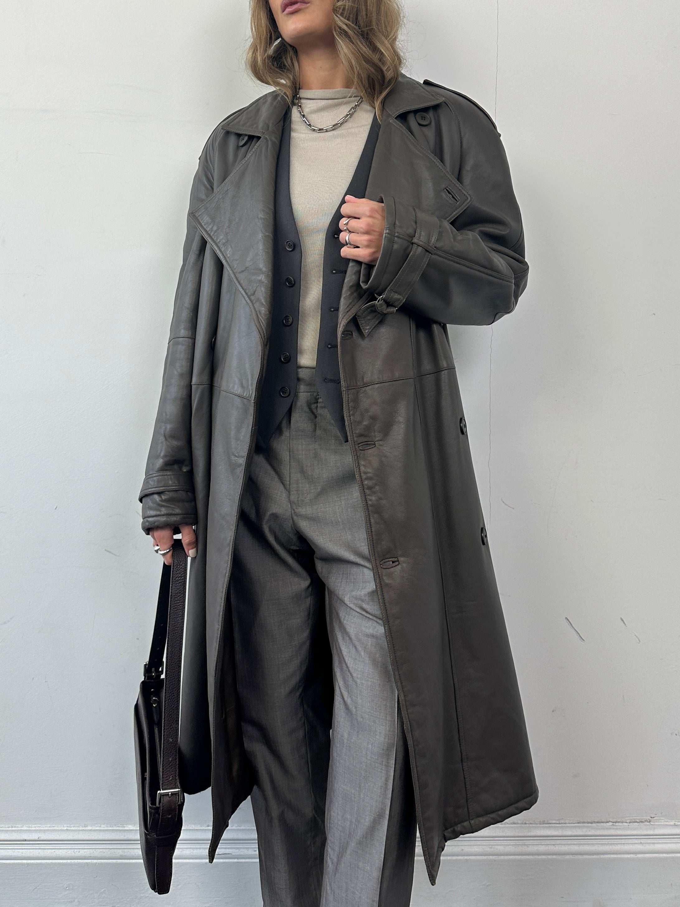 Vintage leather double-breasted belted trench coat, size large, with classic design and tailored fit.