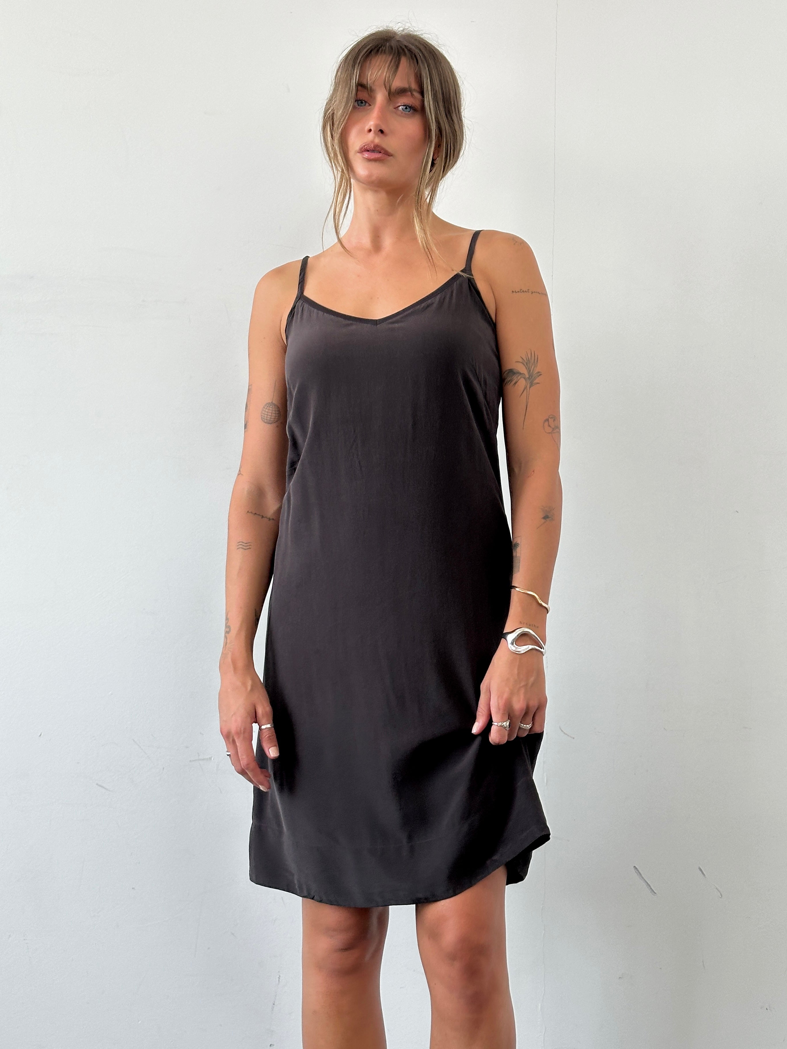 Max Mara S pure silk slip dress shown in a sleek, elegant design with smooth fabric and minimalist style.
