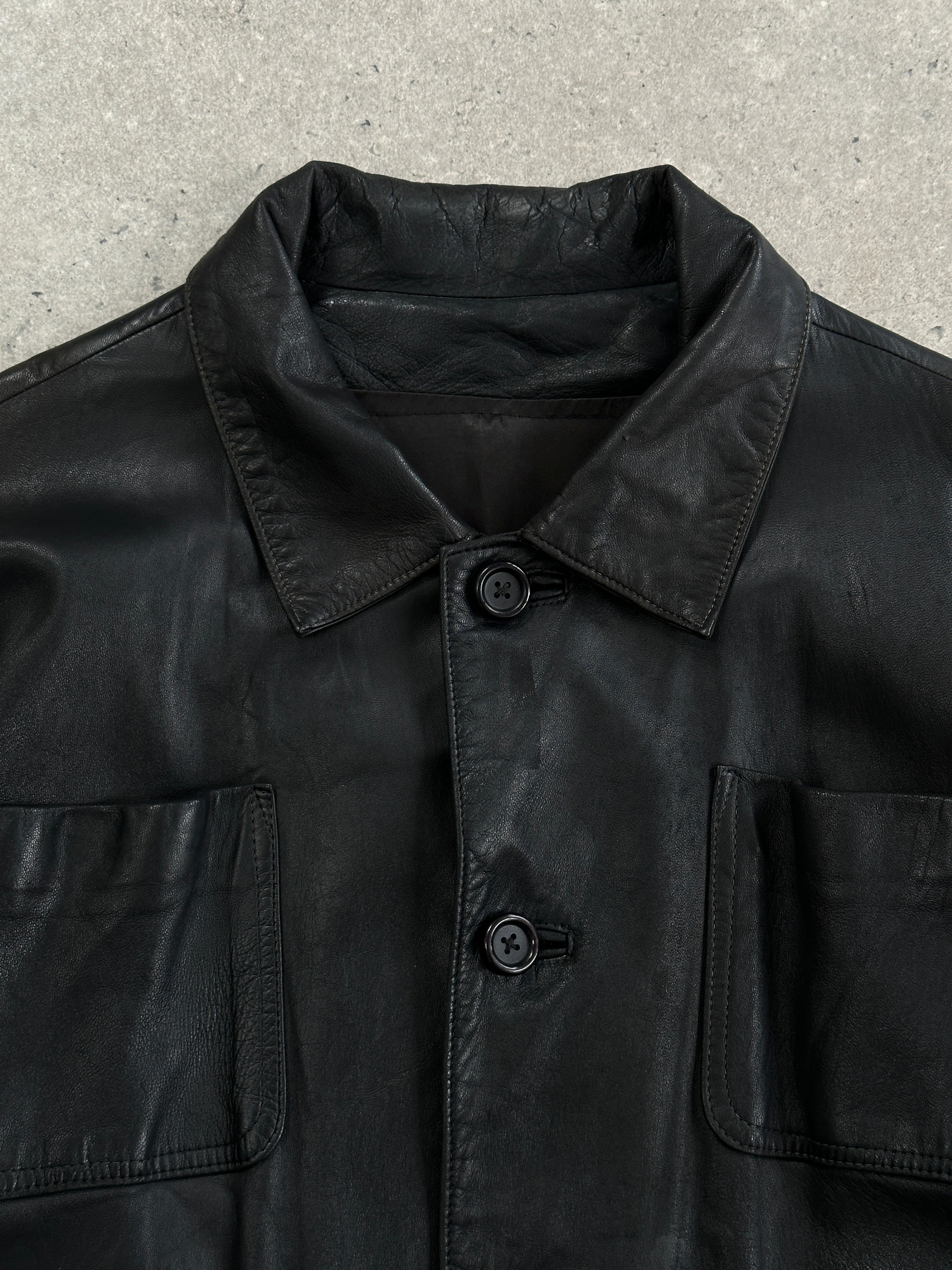 Vintage leather bomber jacket in XL style, featuring minimal design and classic craftsmanship, shown in tan leather finish.