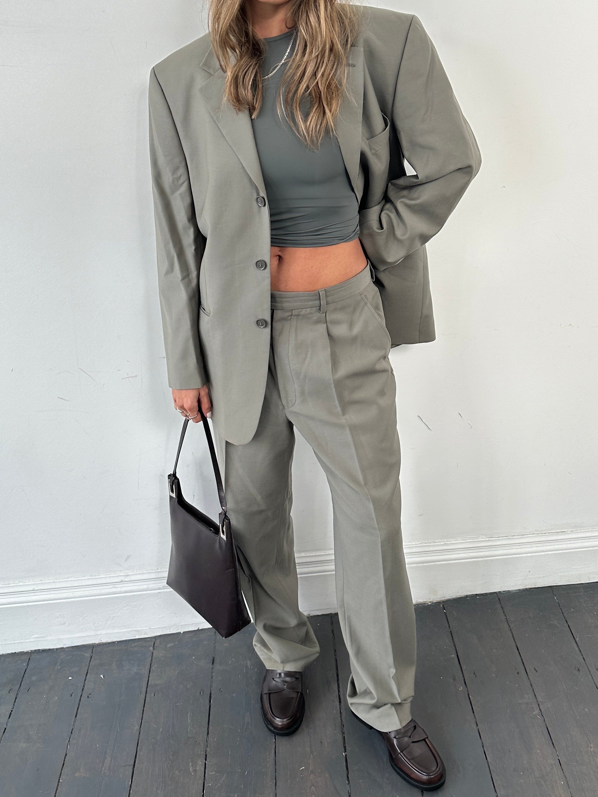 Pierre Cardin pure wool single-breasted jumpsuit in size 40R/W33, tailored fit, shown on a hanger.