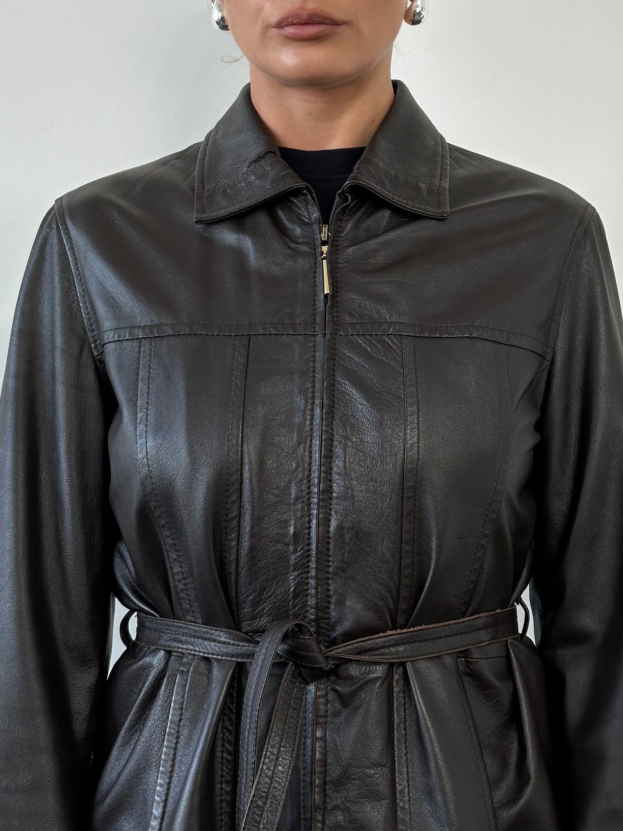 Giorgio Armani Black Label belted leather jacket in black, front view showing tailored design and belt details.