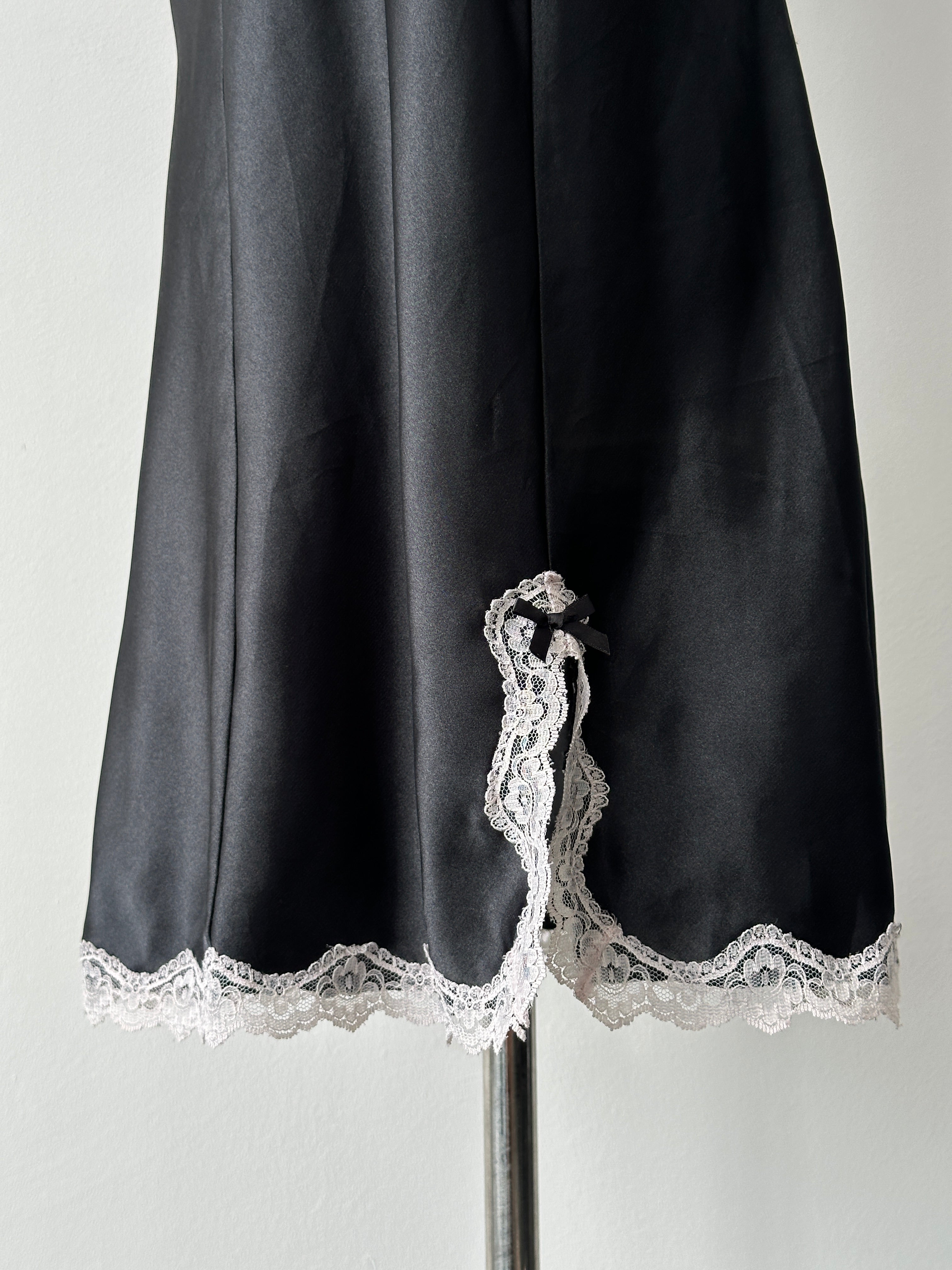 Vintage 1990s satin lace mini slip dress in black with delicate lace trim, size S-M, vintage fashion style.