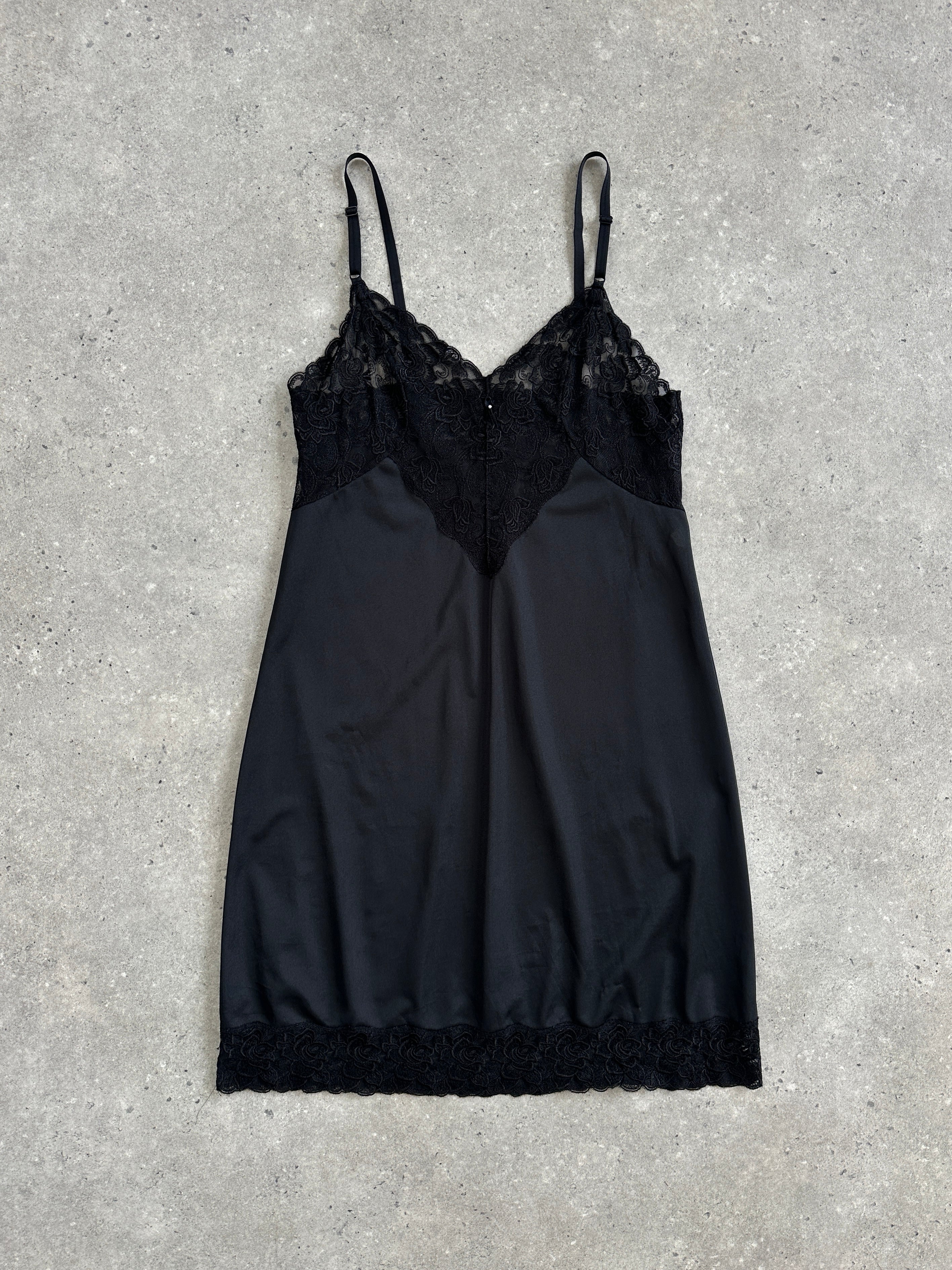 Vintage 1990s lace mini slip dress in S/M size, featuring delicate lace fabric and a classic vintage style.