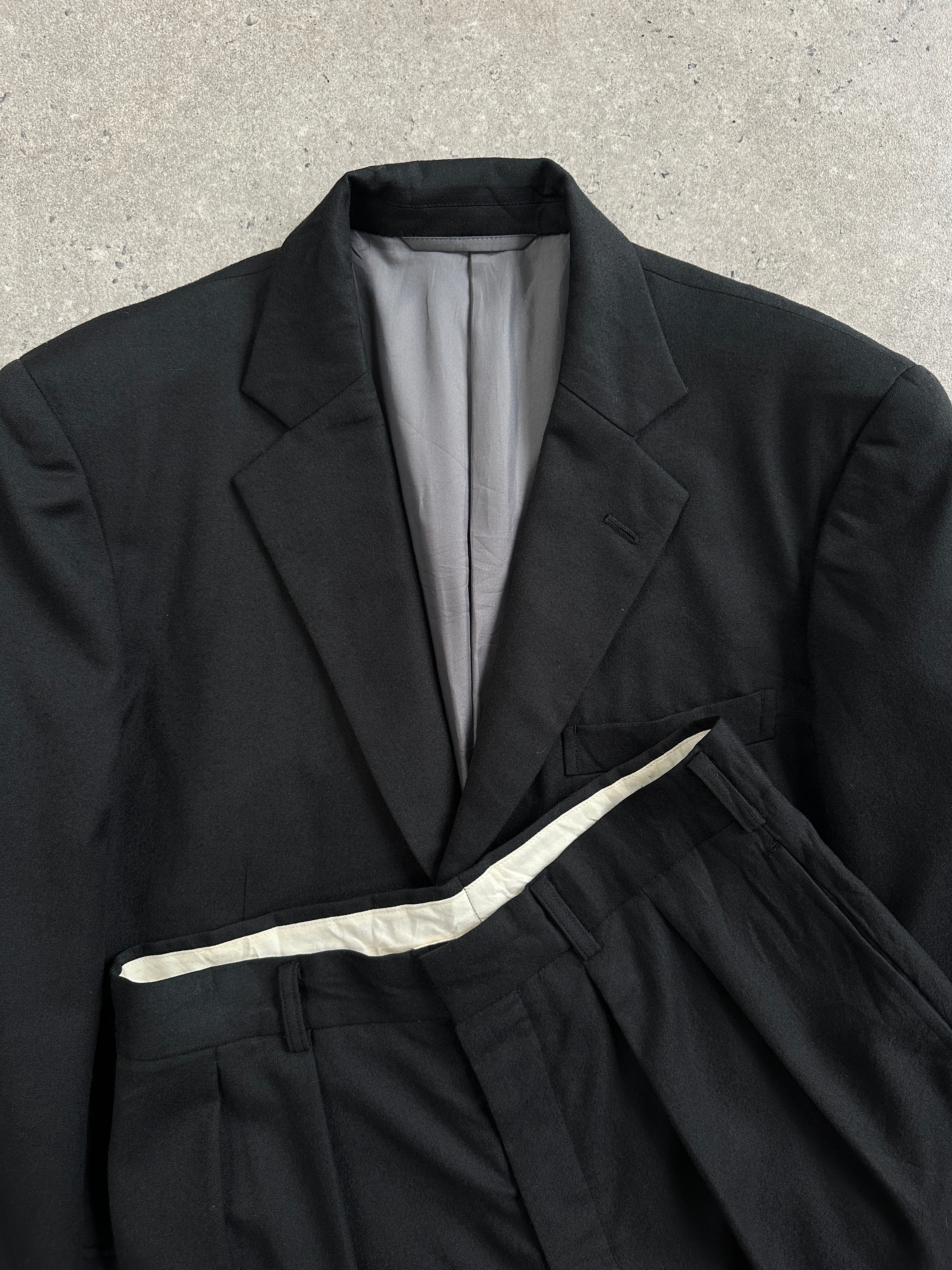 Vintage Japanese 1990s pure wool straight leg suit in size 40R/W26, featuring classic tailored design and neutral color.