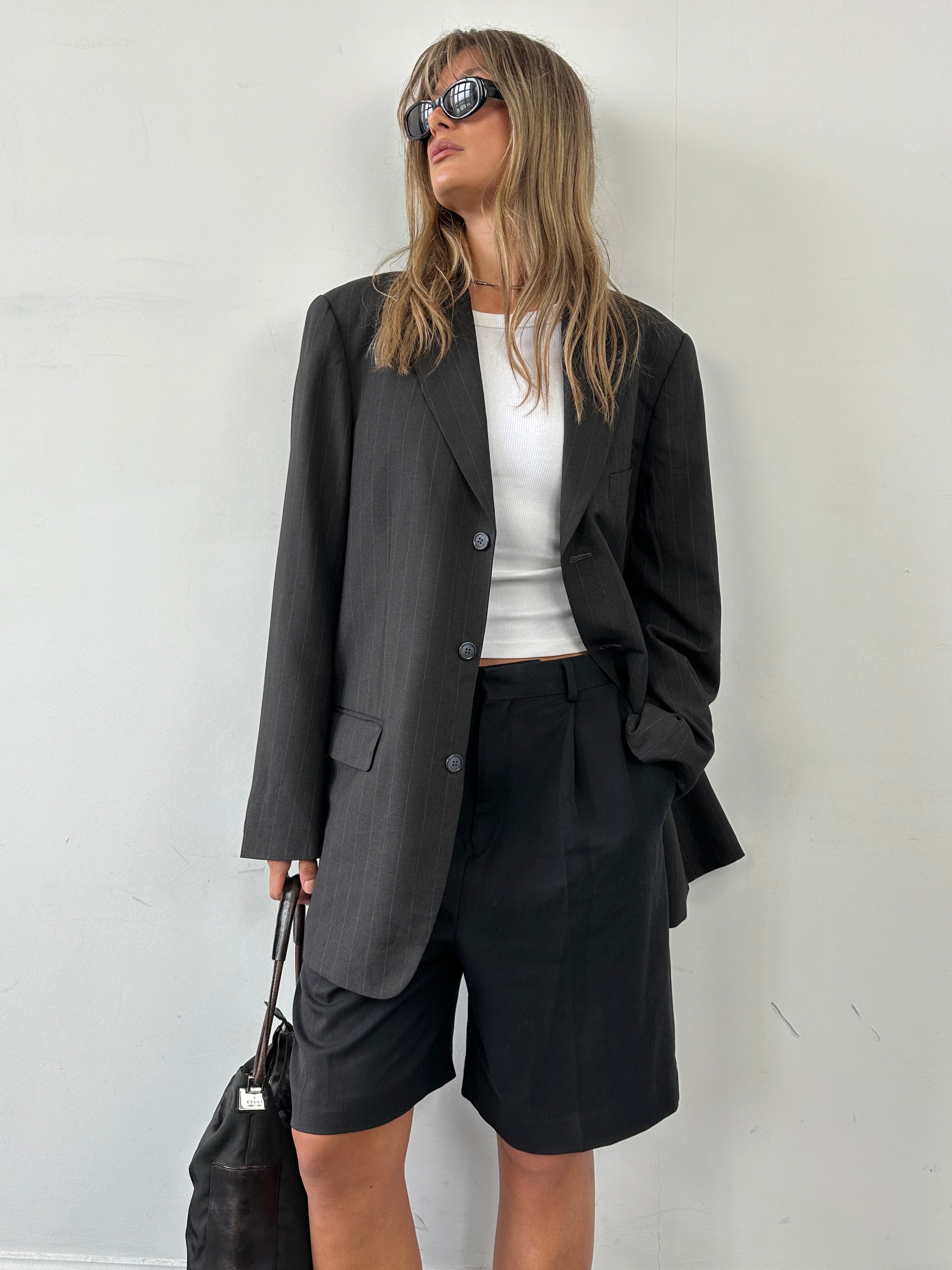 Vintage pinstripe wool blazer, single-breasted style in size 44R/XXL, featuring classic tailored design and notch lapel.