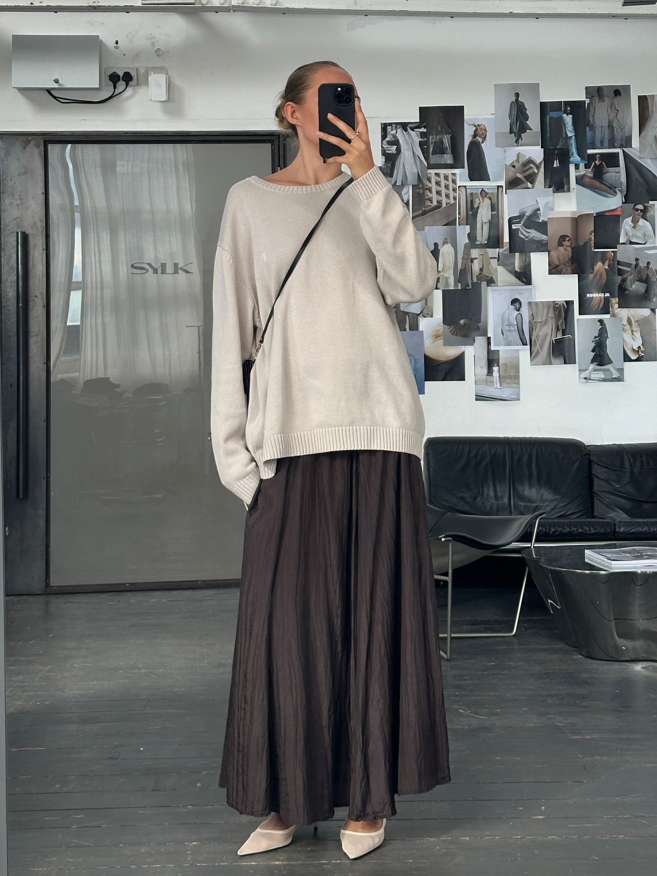 Vintage 1990s pure silk crinkle midi skirt in soft pink, showing the flowing fabric and stylish mid-length design.