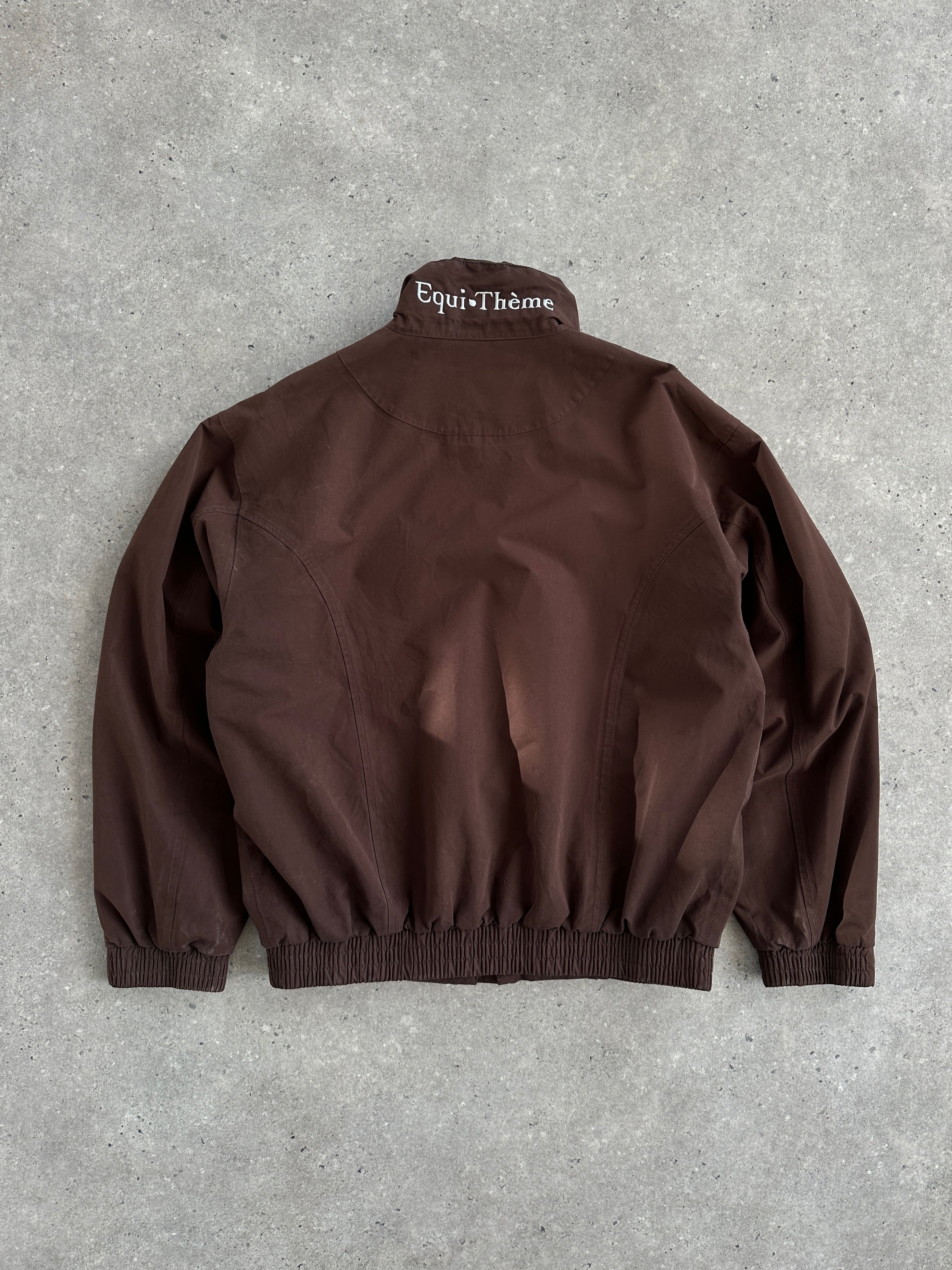 Vintage 2000s double zip boxy bomber jacket, front view showing black fabric and silver zippers, size M/L.