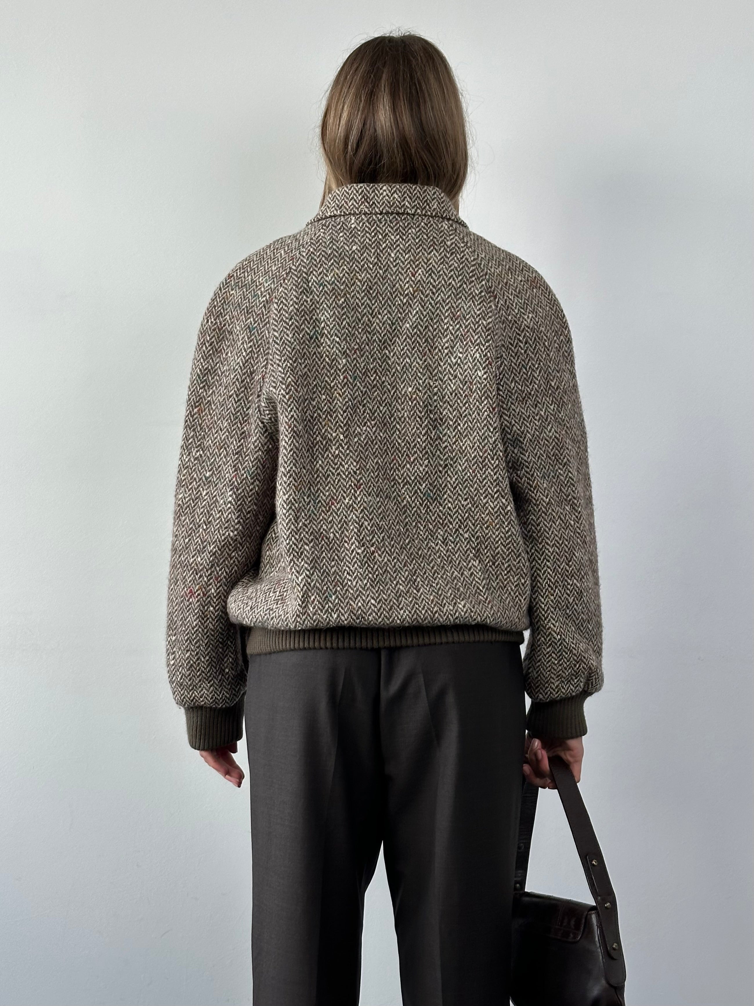Vintage pure wool herringbone bomber jacket in size L, featuring a classic collar, front zipper, and fitted cuffs.