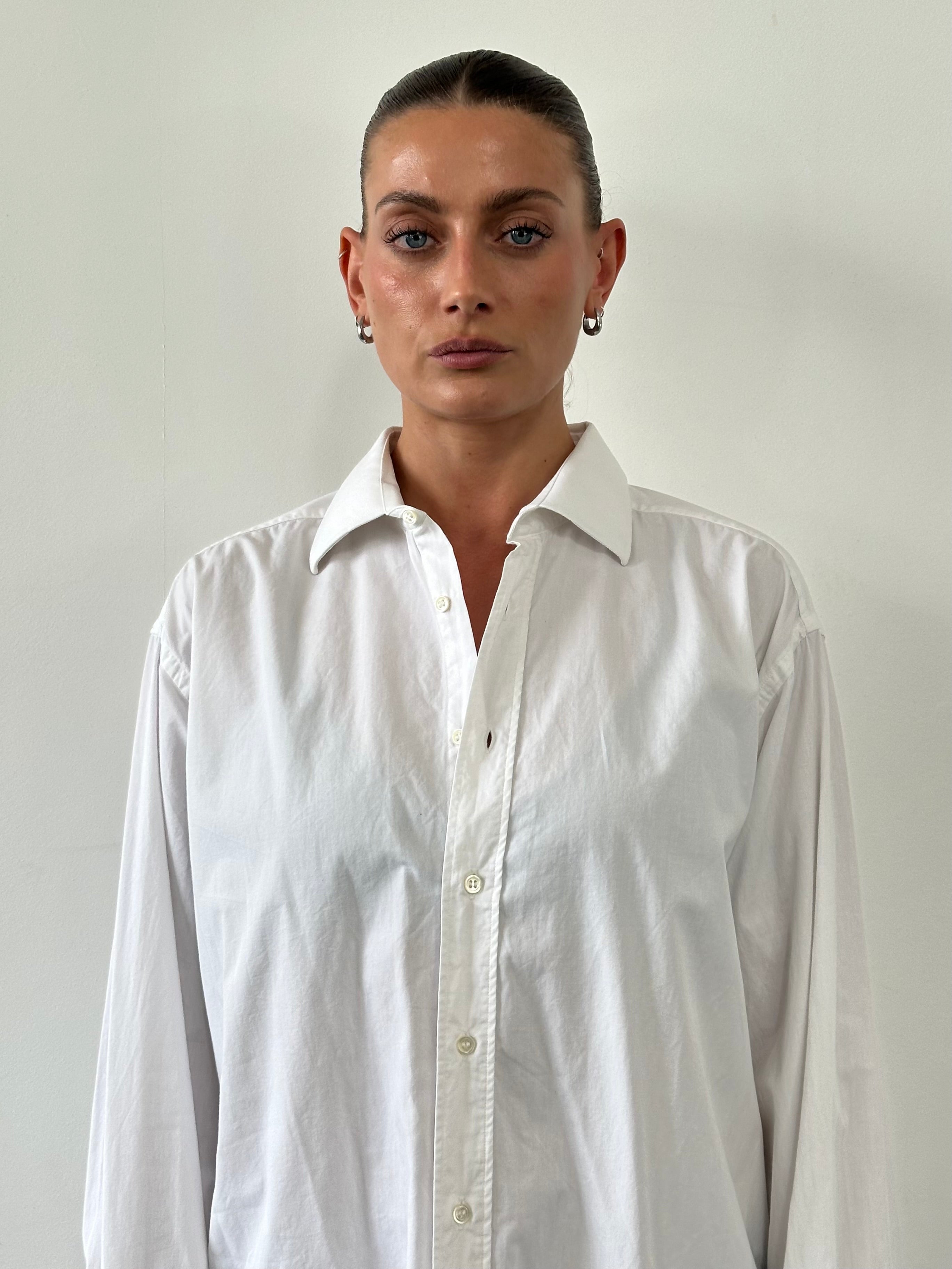 Christian Dior cotton dress shirt in size L/XL, light blue with button-down collar and classic fit, styled for formal occasions.