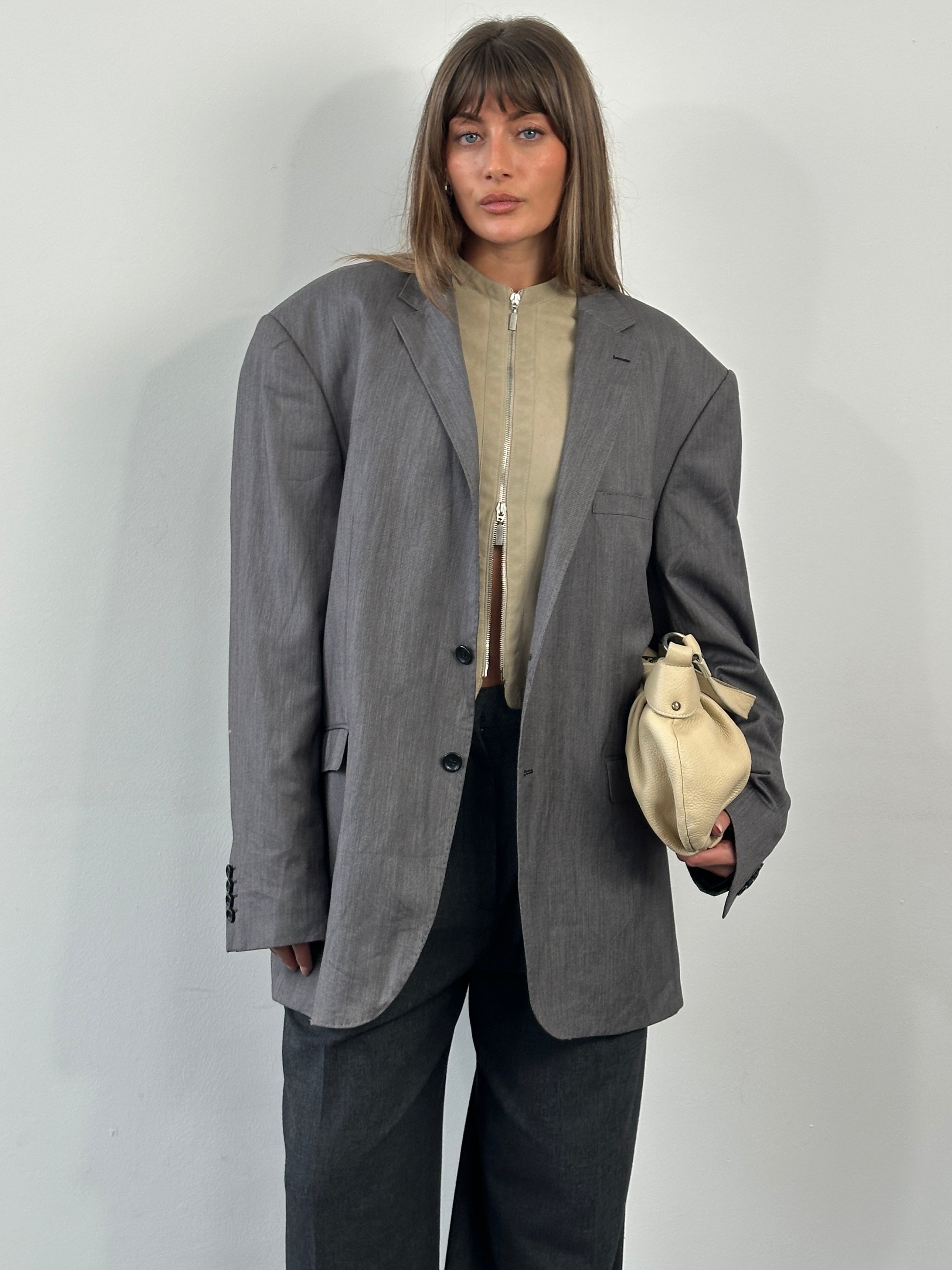 Loro Piana Doremen 1990s wool single-breasted blazer in size 50R, tailored fit, dark gray fabric with classic lapel details.