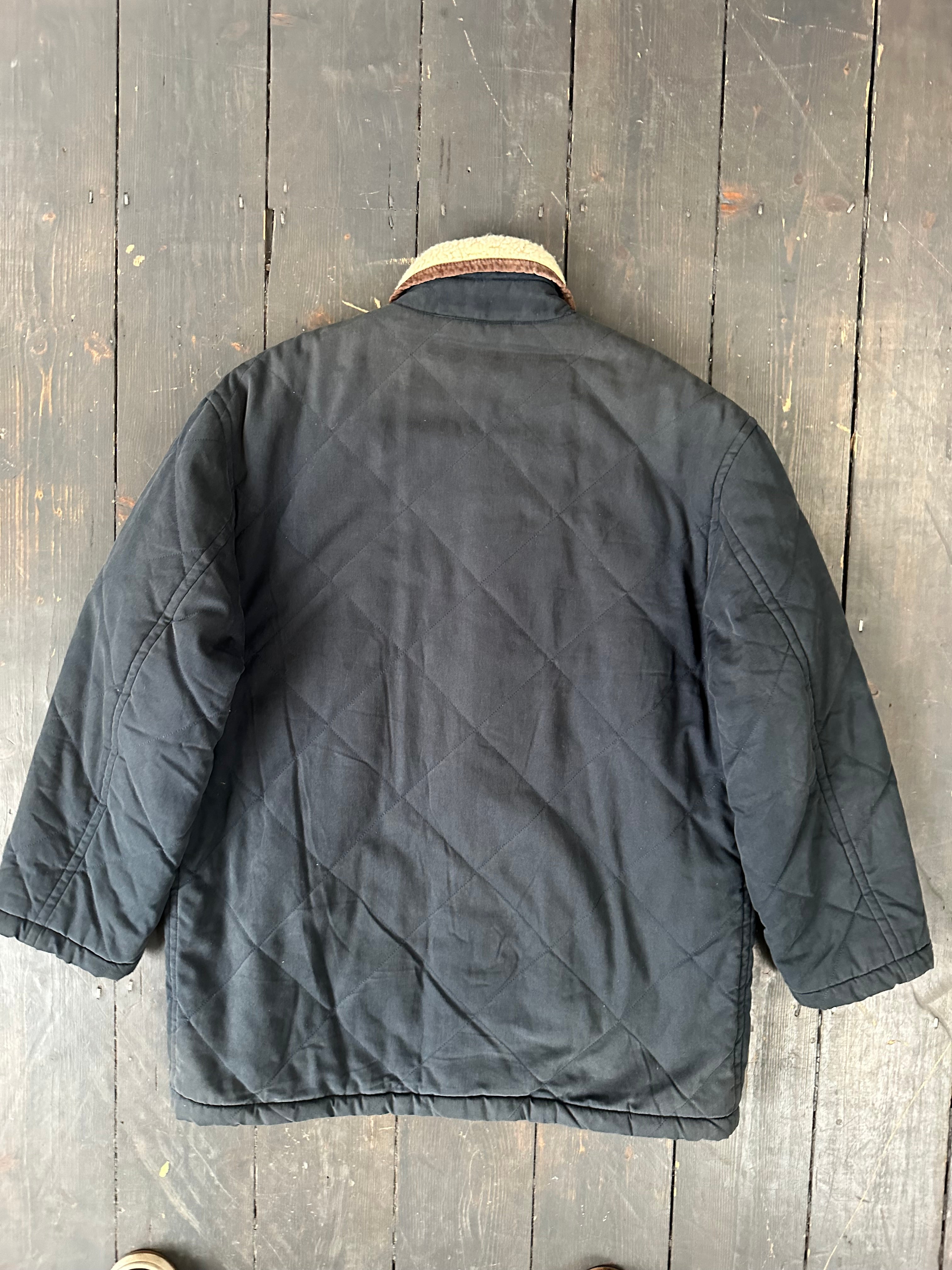 Yves Saint Laurent wool-lined jacket in XL with a tailored fit, featuring a sleek design and classic details.