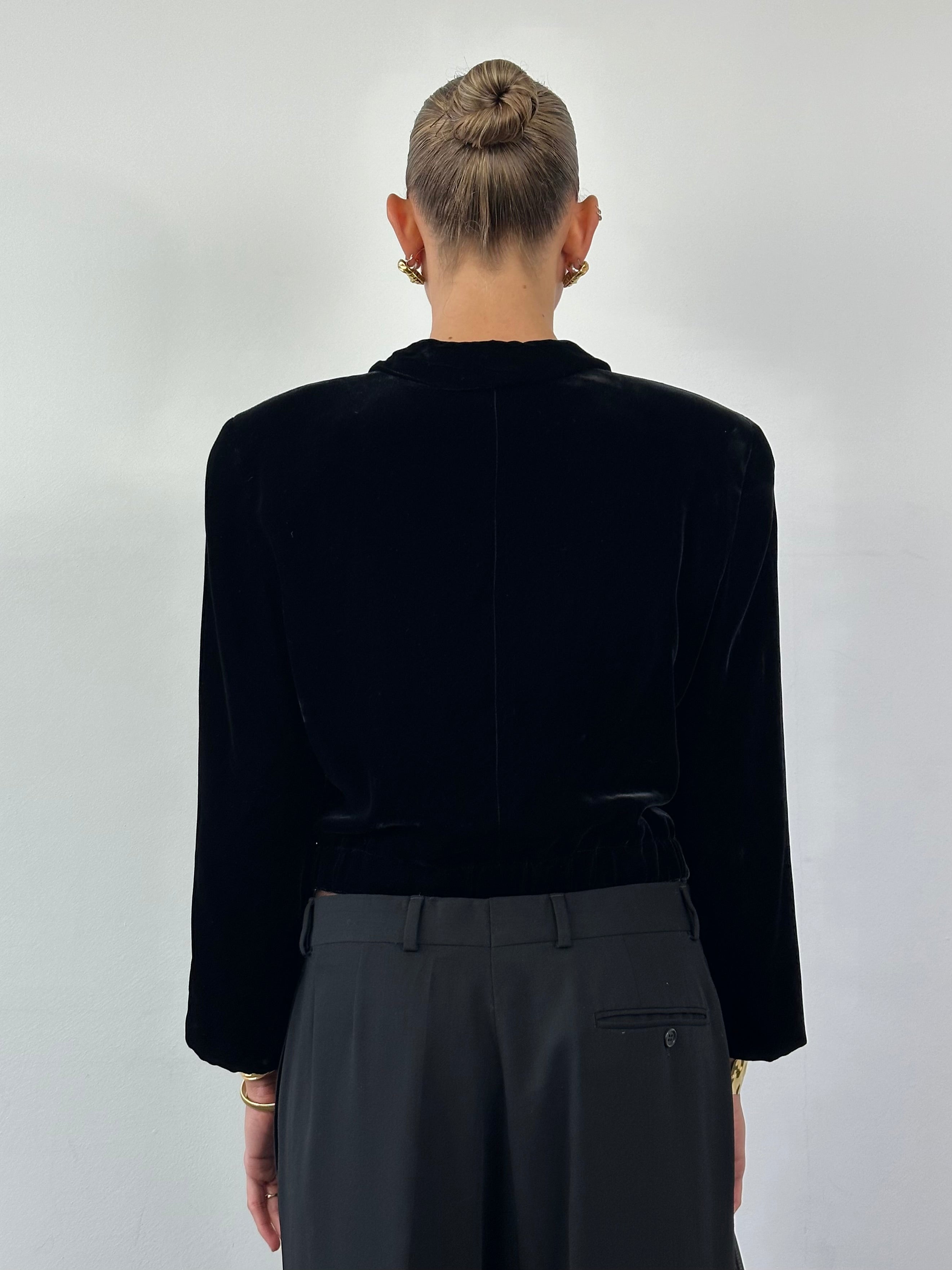 Giorgio Armani black velvet cropped blazer from the 1980s, tailored fit, with a sleek, classic design and structured shoulders.