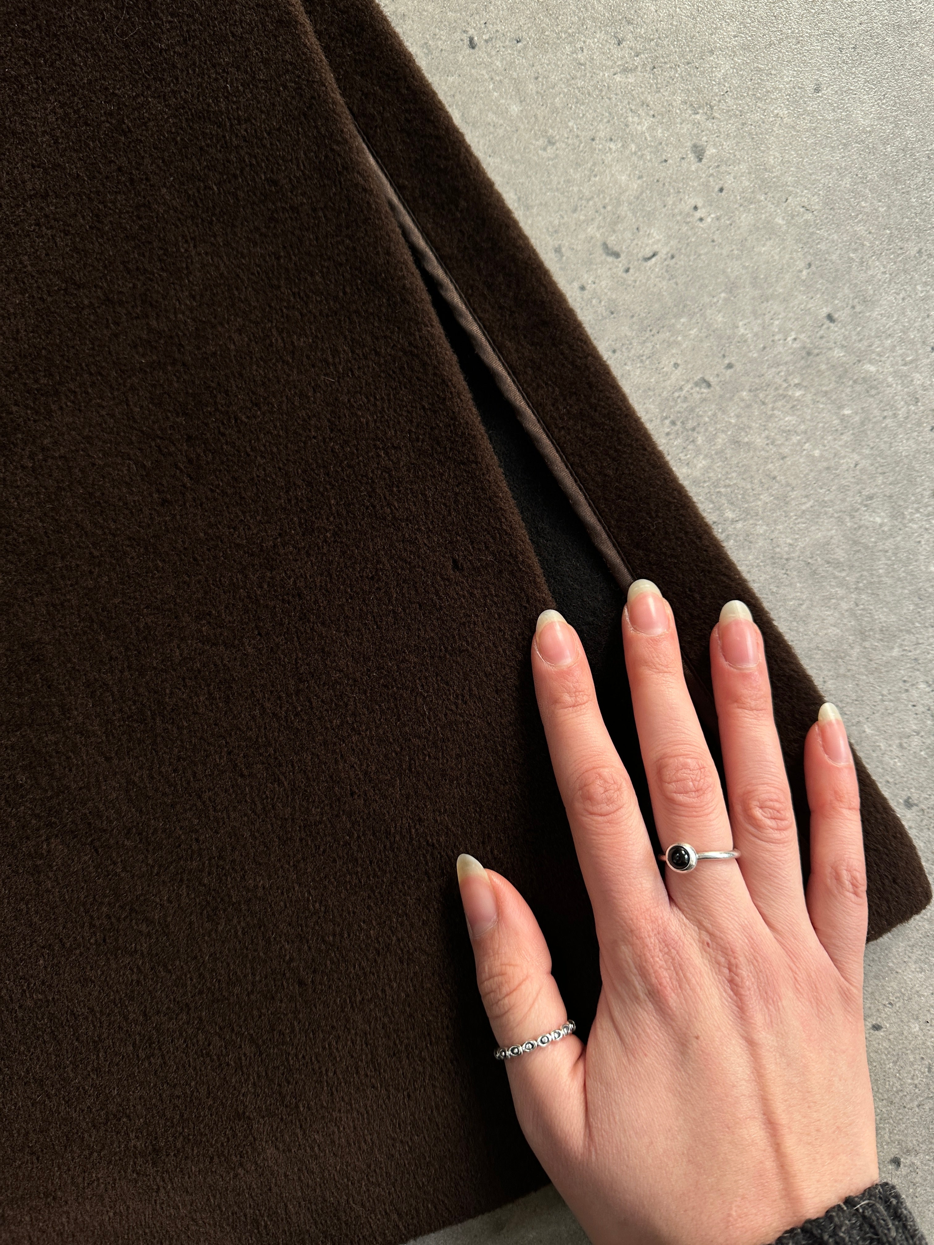Max Mara wool cashmere double-breasted floor-length coat in size L, shown hanging on a wooden rack with a neutral background.