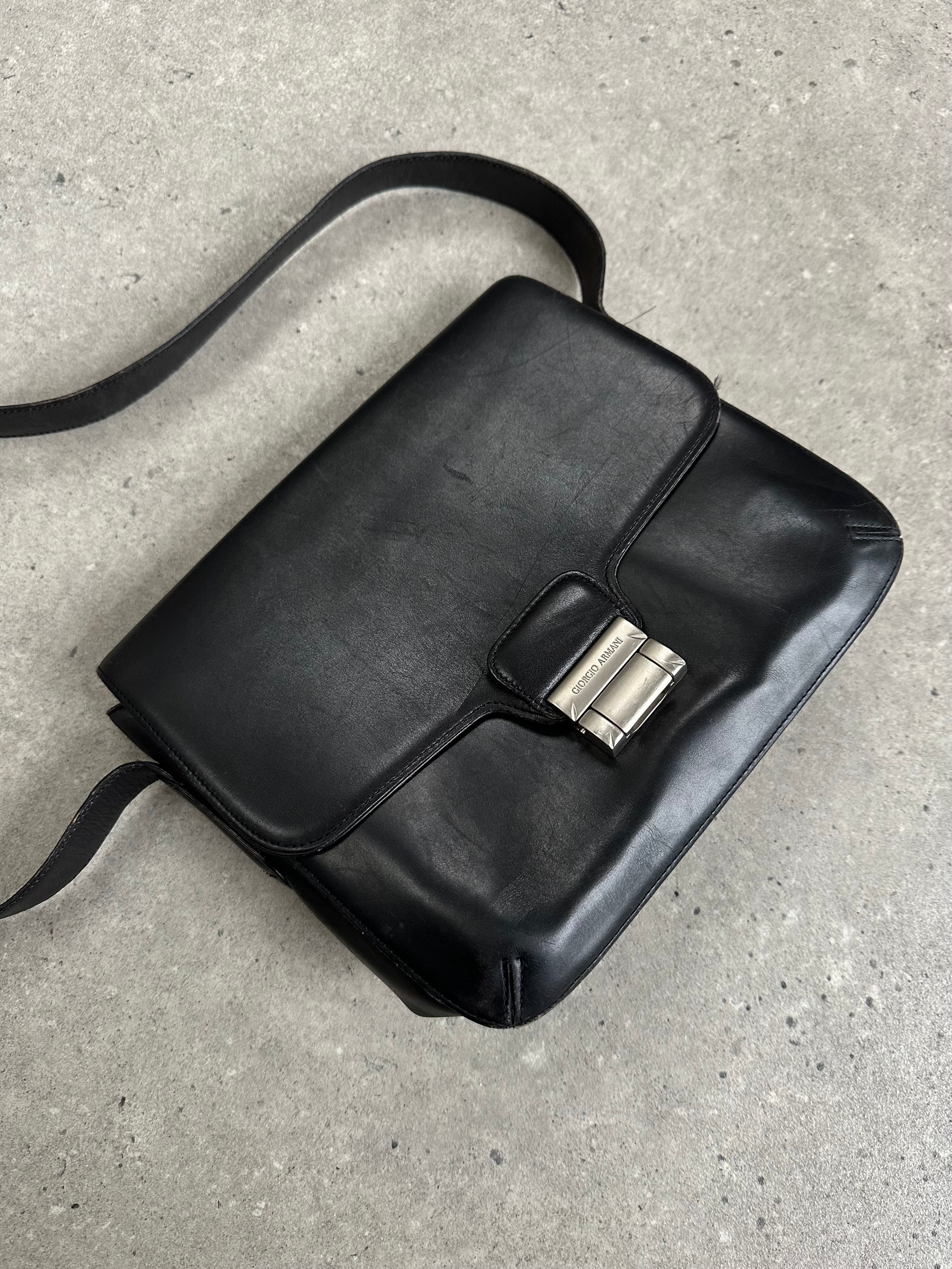 Giorgio Armani Le Collezioni leather crossbody bag in 2000s style with sleek design and adjustable strap.