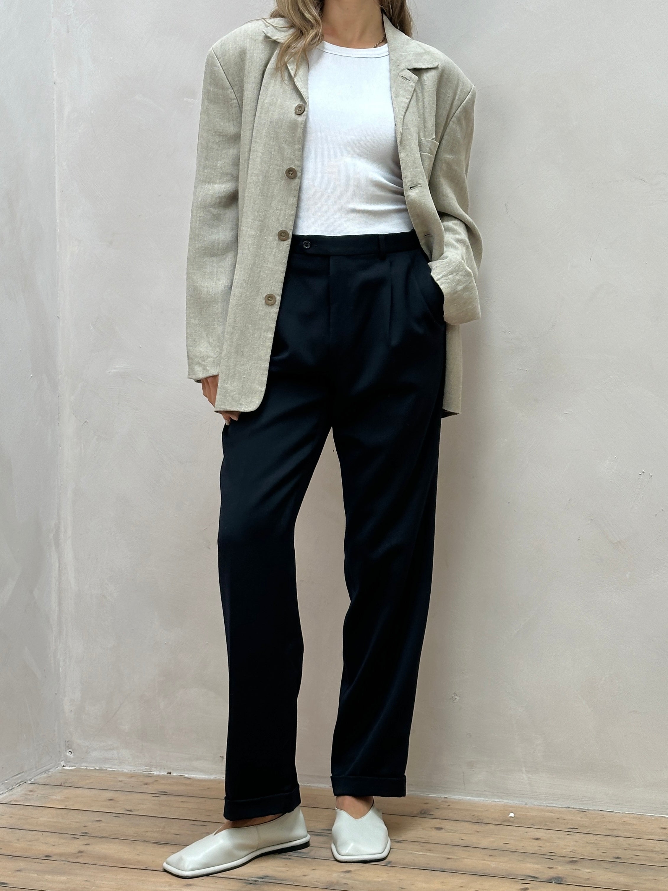 Vintage Italian high-waisted wool trousers with tailored fit, shown in classic style on a neutral background.