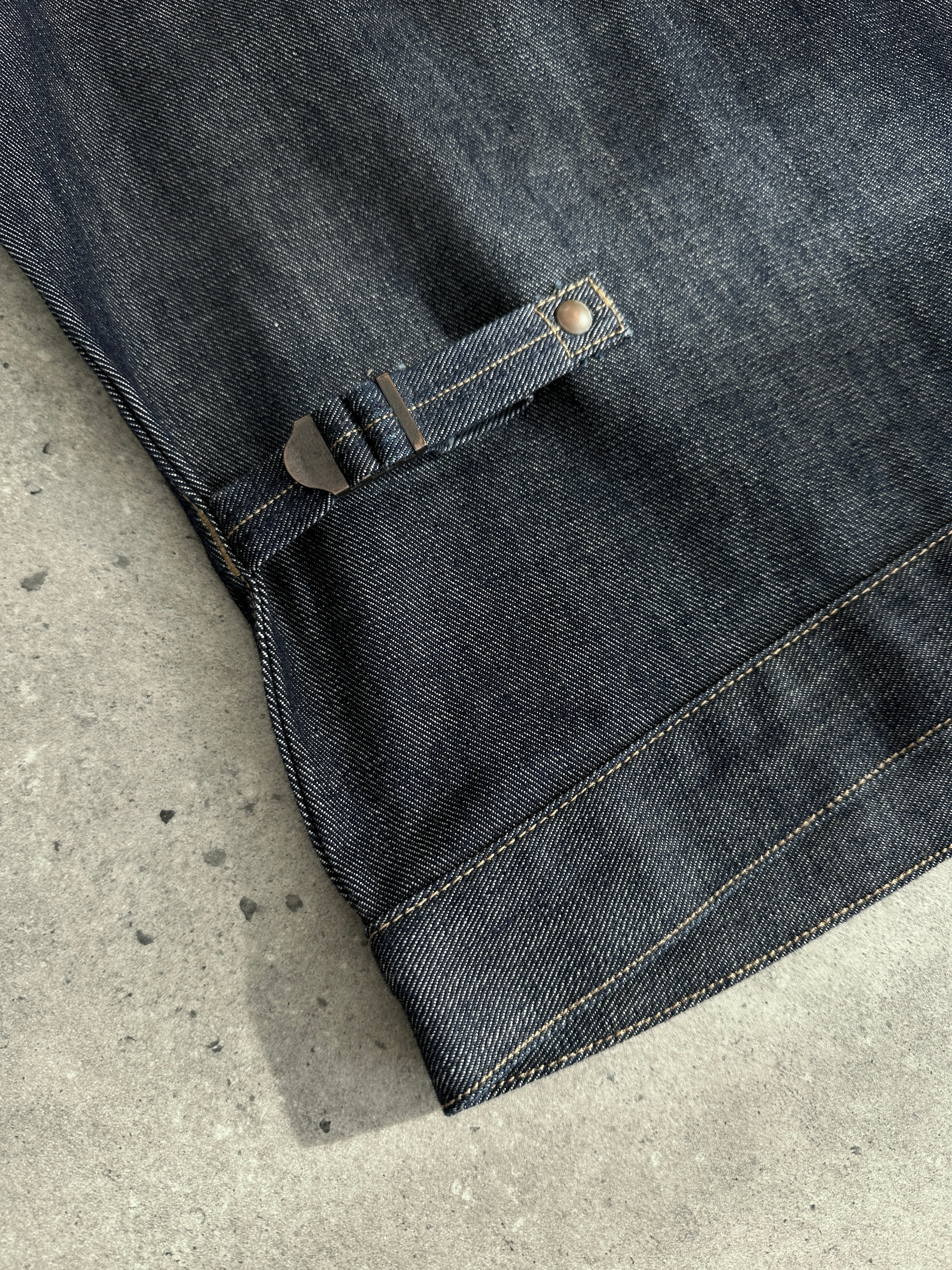 Wrangler organic cotton denim jacket in size small/medium displayed on a hanger, showcasing classic blue denim style.