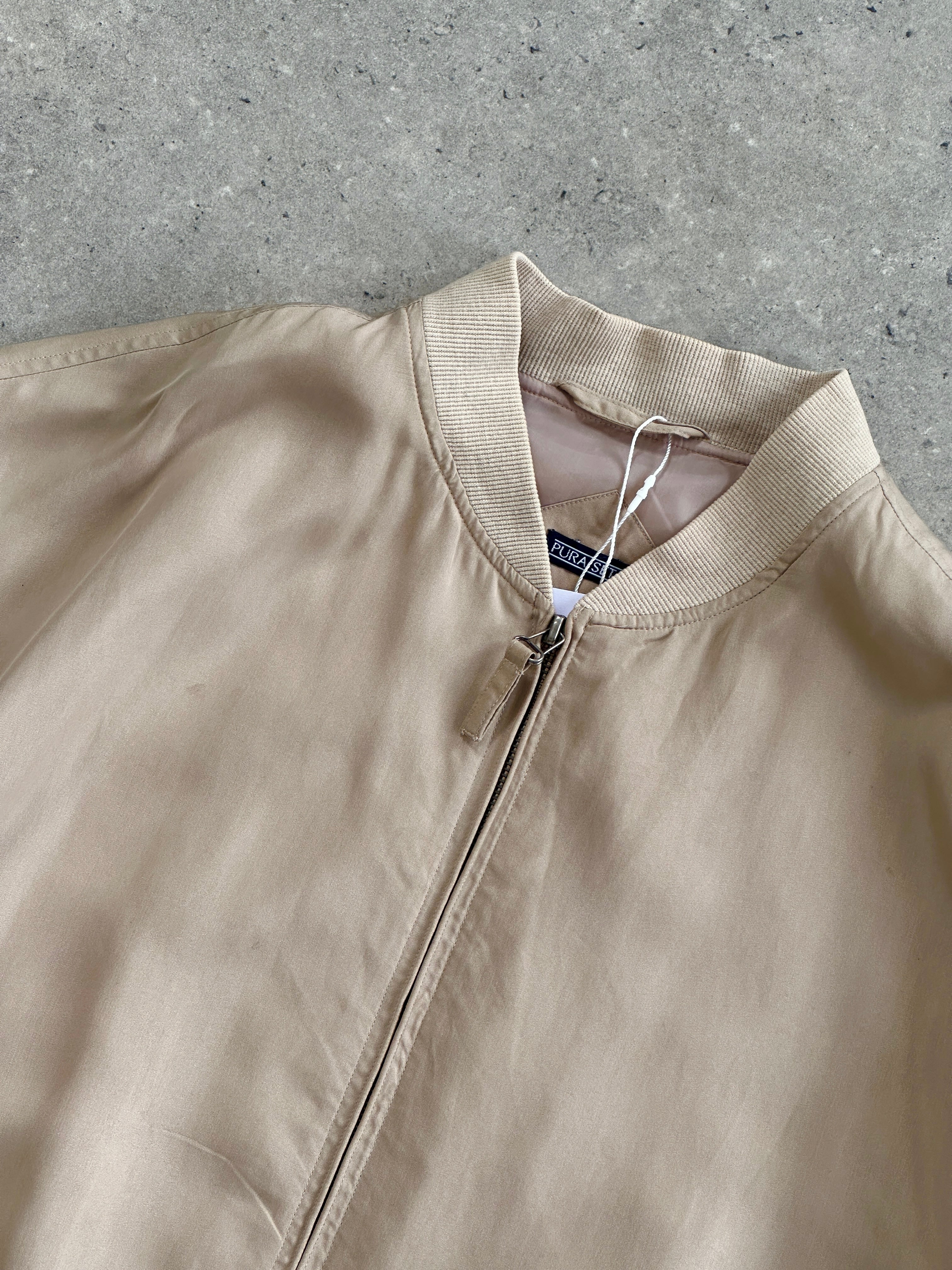 Vintage pure silk bomber jacket in size XL with a classic design, featuring a smooth silk fabric and stylish details.