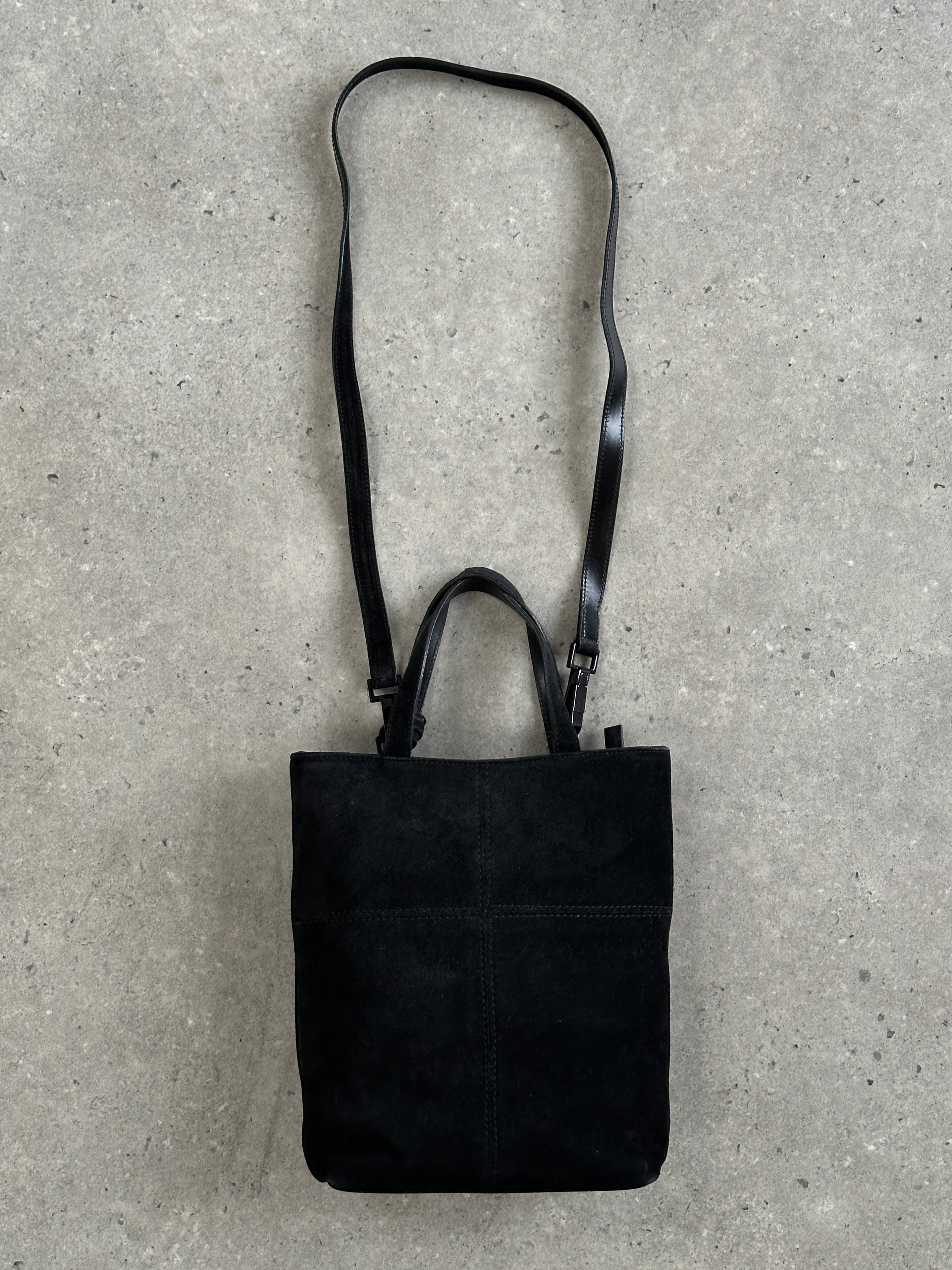 Gucci 2000s suede top handle crossbody bag with sleek design and compact size, featuring a stylish and functional accessory for everyday use.