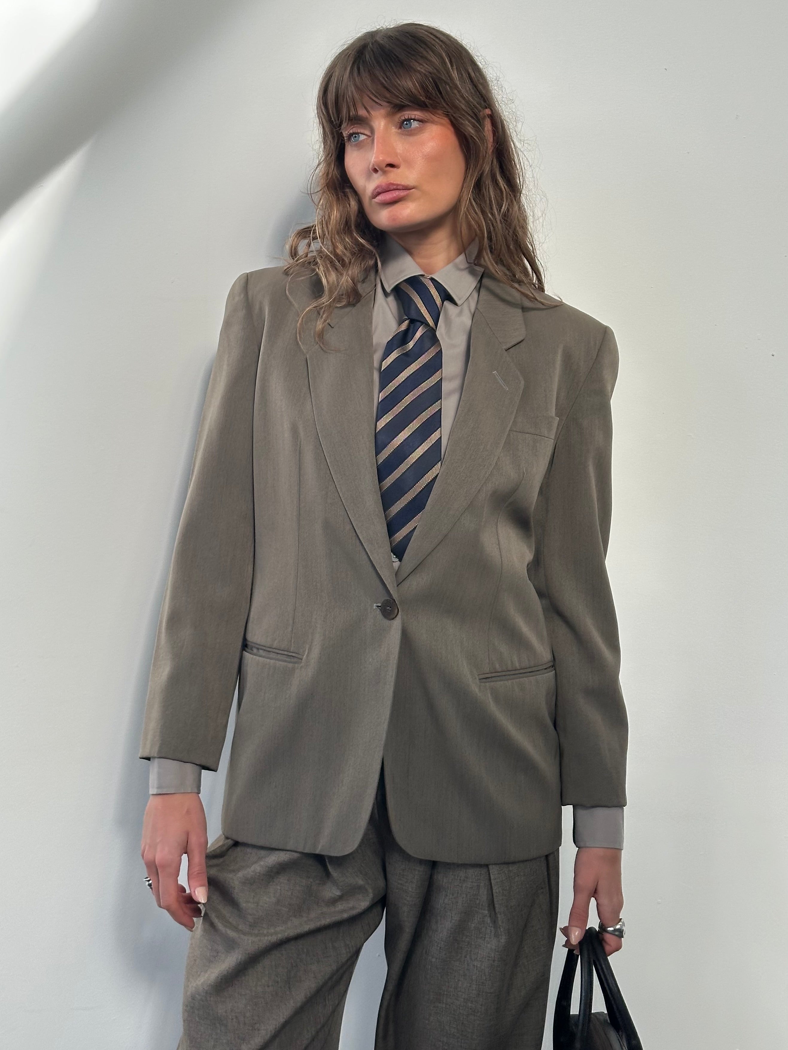 Mani 1990s wool blazer with single button, tailored fit in size S, featuring classic lapel and structured design.