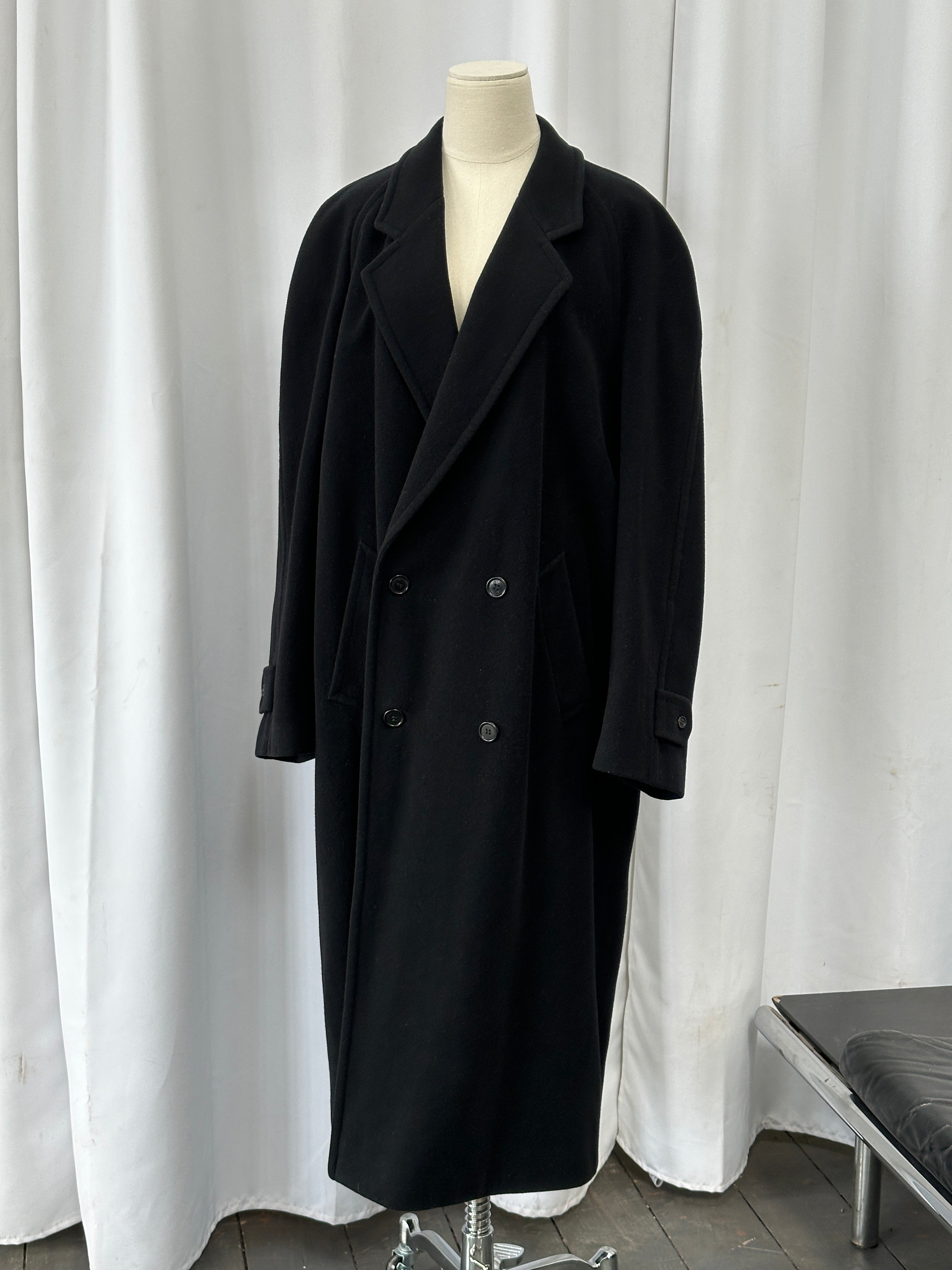 Vintage 1990s wool cashmere double-breasted coat in XL, featuring classic design and neutral color, hanging on a wooden hanger.