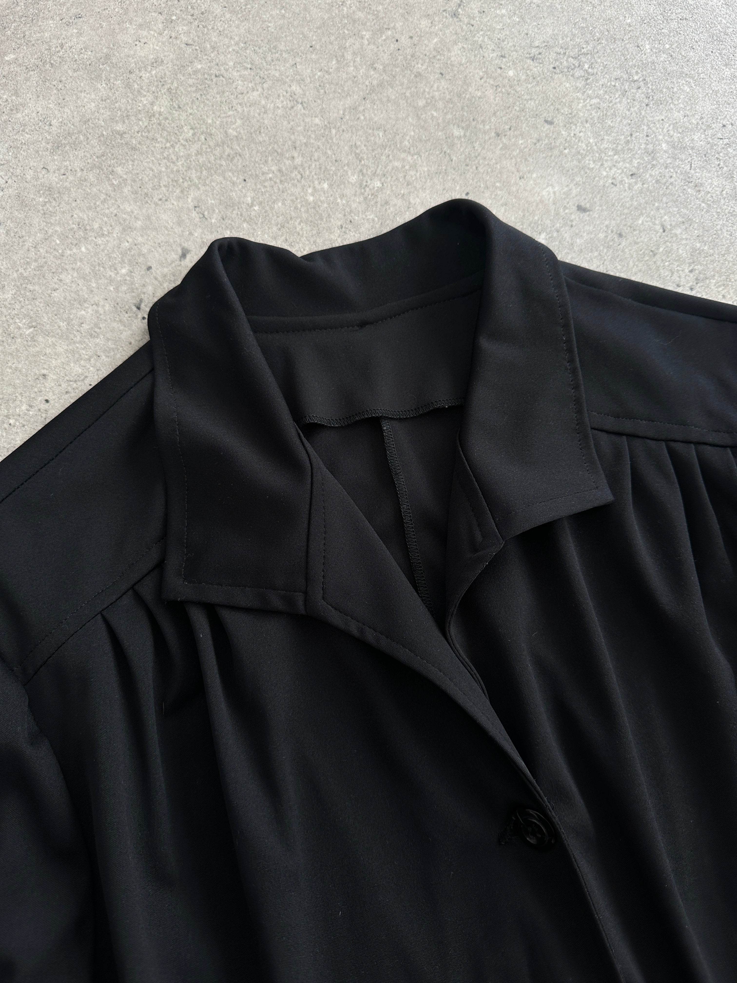 Vintage 1990s belted short sleeve midi shirt dress, showing the classic collar, button front, and waist belt on a mannequin.