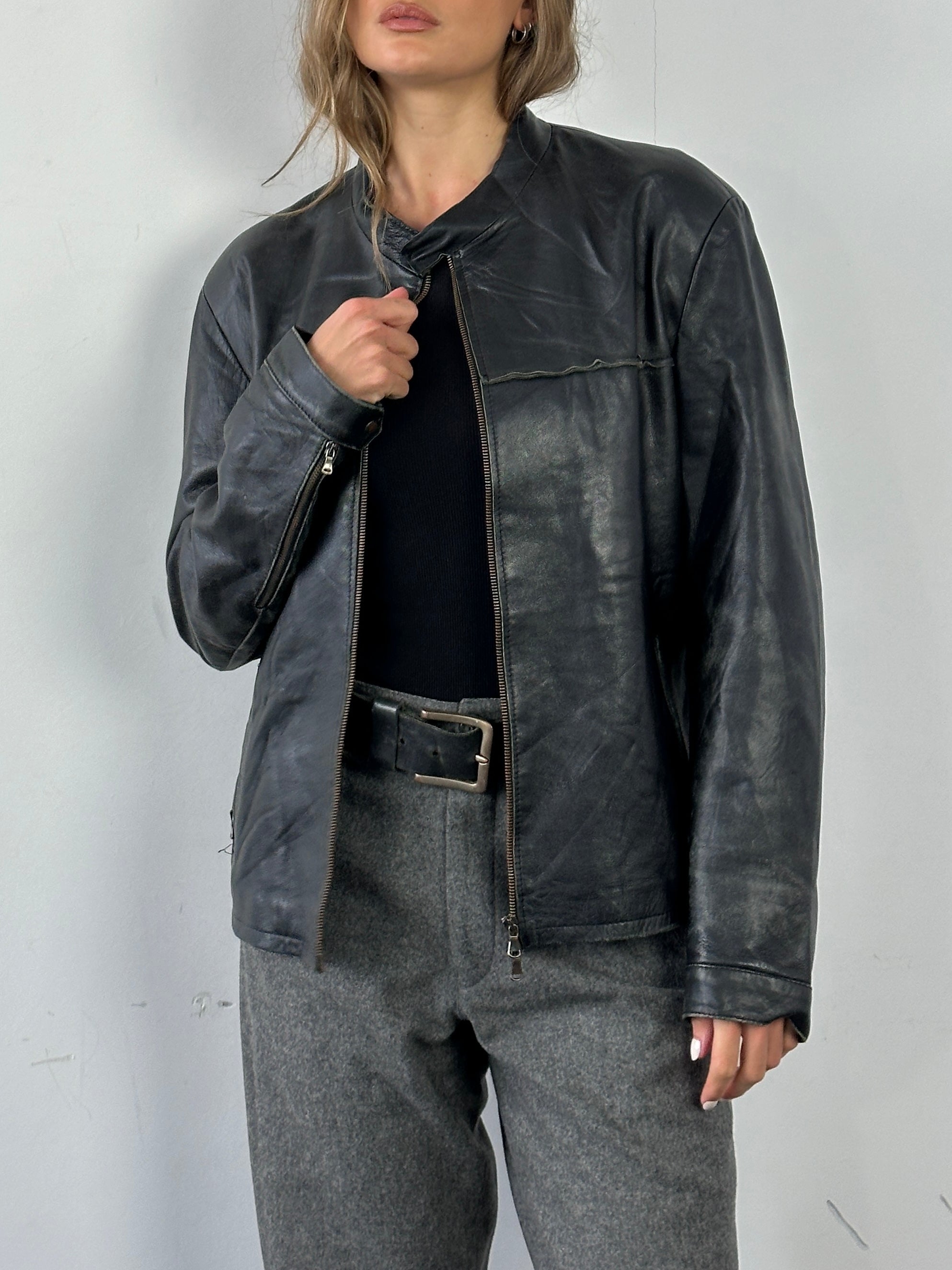 Vintage Italian double zip leather jacket in size M, showcasing classic design and high-quality brown leather detail.