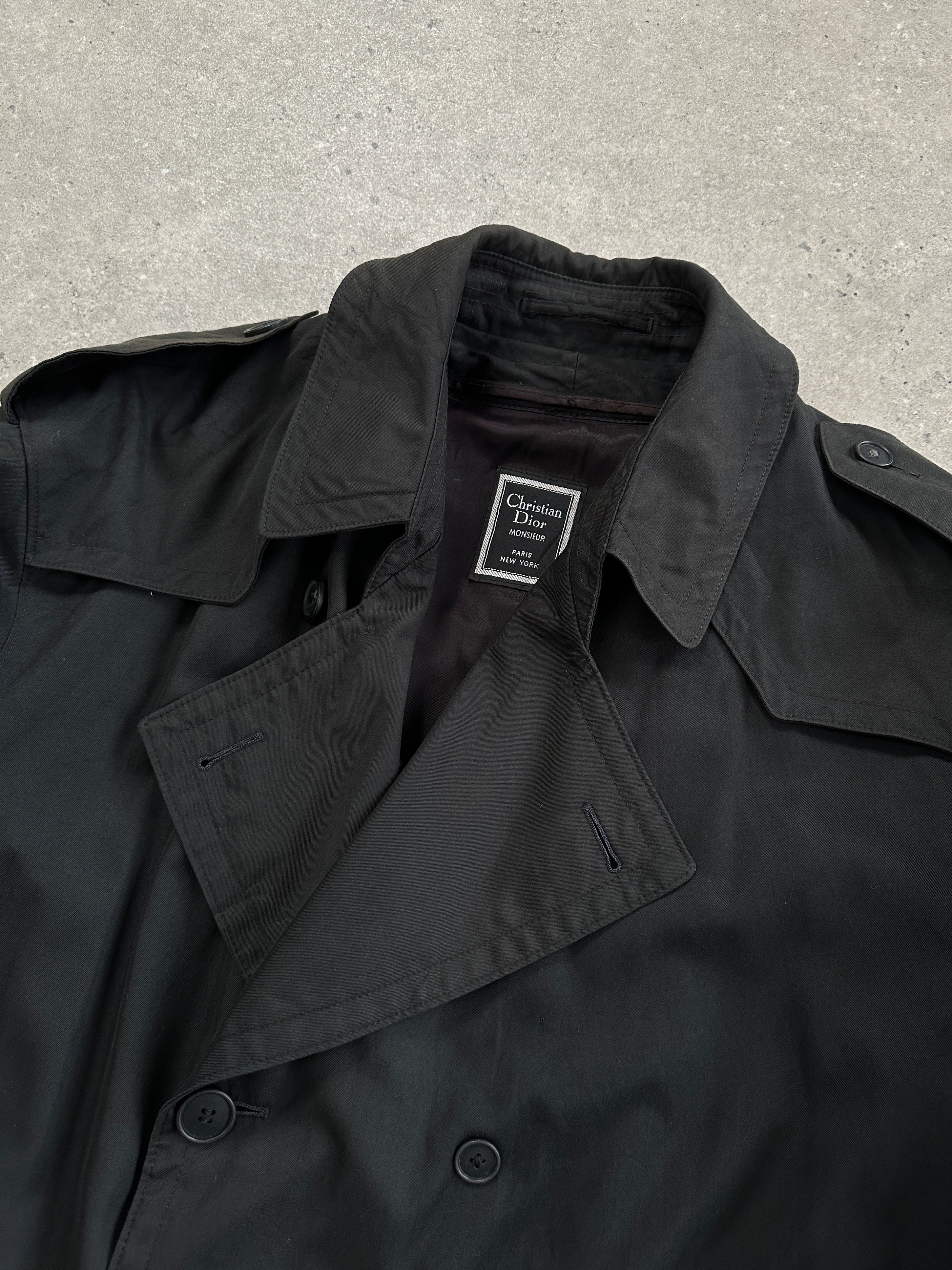 Christian Dior Monsieur double-breasted trench coat in XL, shown in dark fabric with classic tailored design and belt detail.
