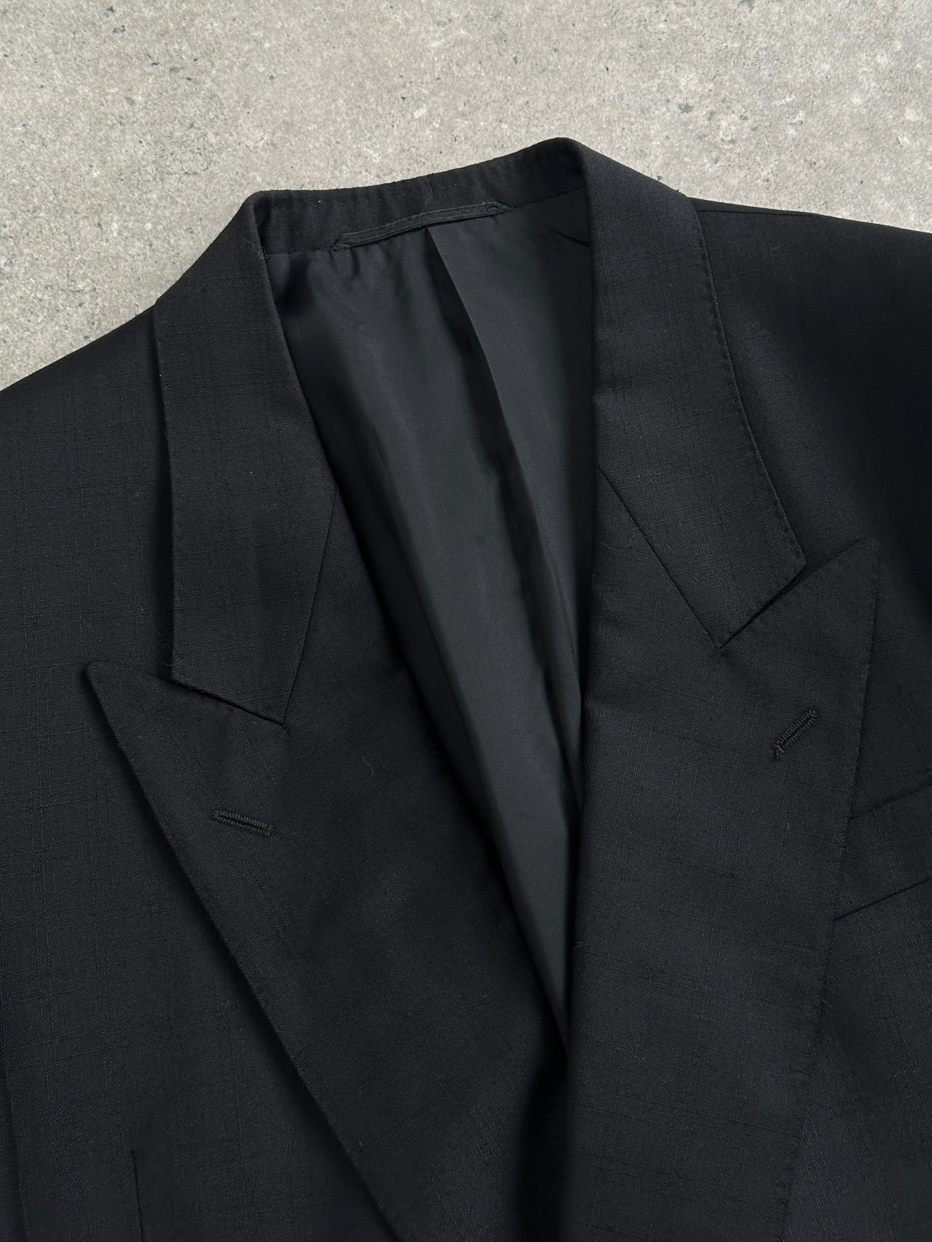 Vintage wool double-breasted blazer in size 40R, featuring classic tailored fit and vintage style with dark button details.