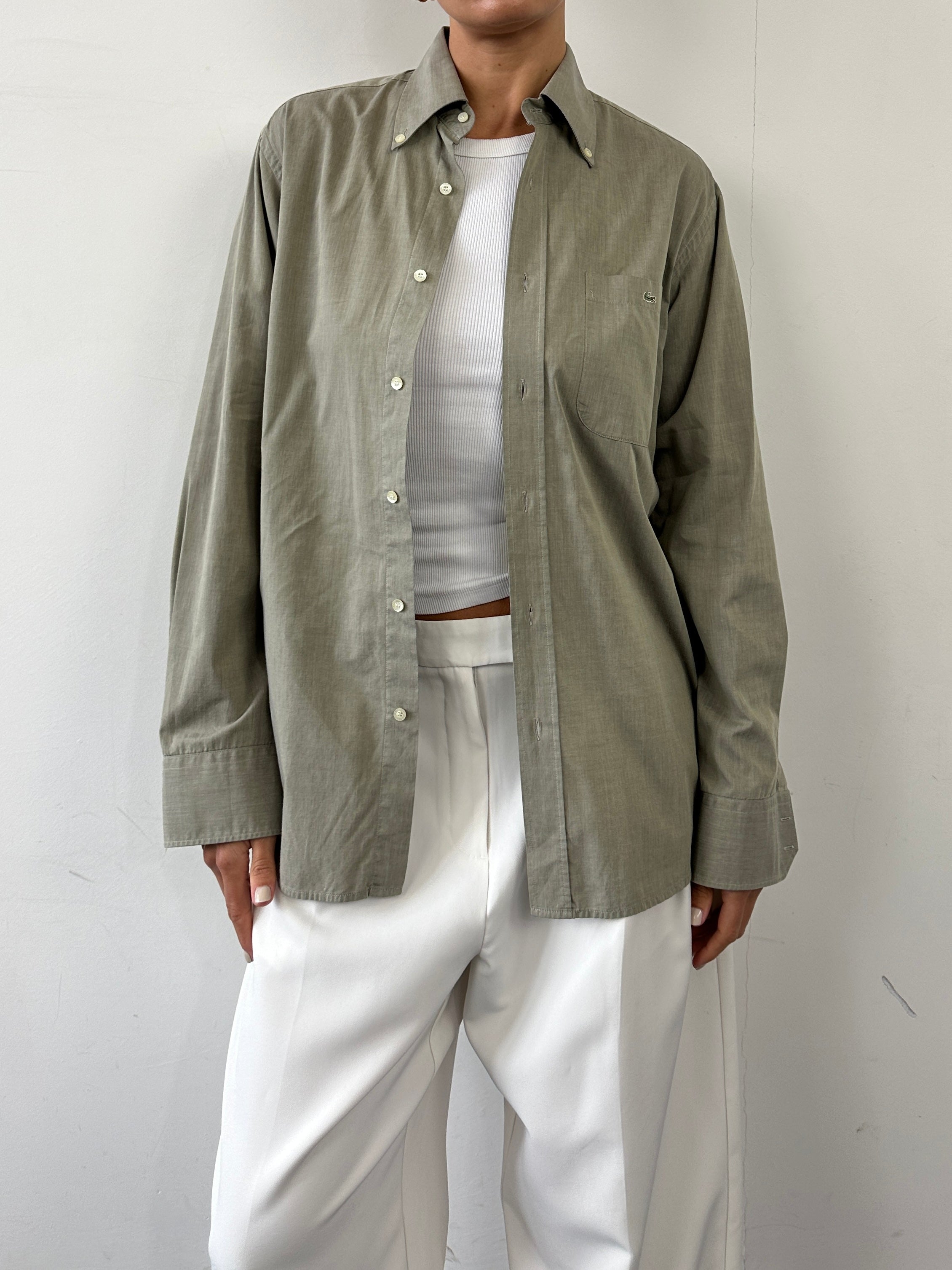 Lacoste pure cotton logo shirt in size M, featuring classic design and embroidered crocodile logo on the chest.