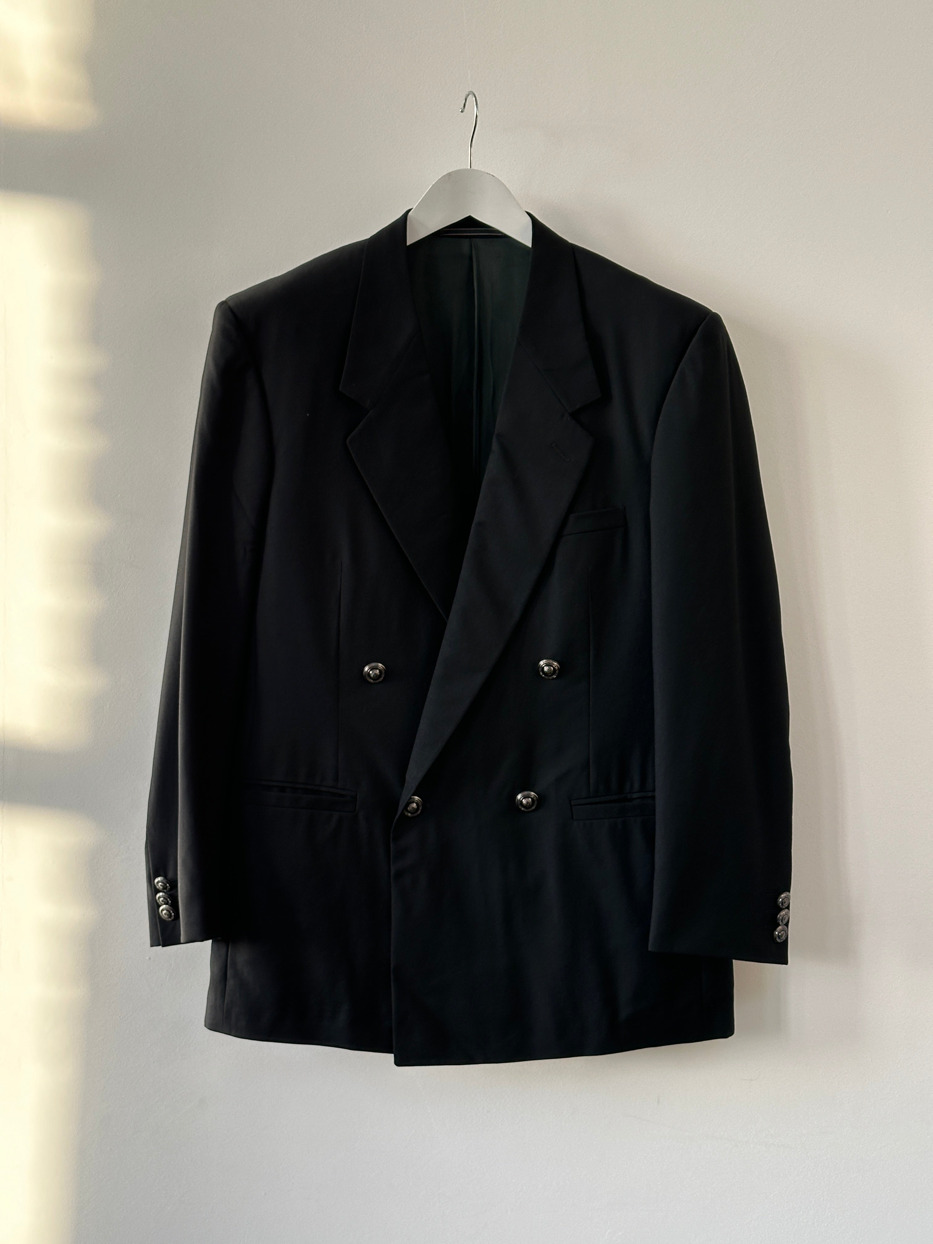 Versace Gianni Versace 1990s bespoke Medusa button double-breasted blazer in size 40R/L, tailored with classic design and Medusa accents.