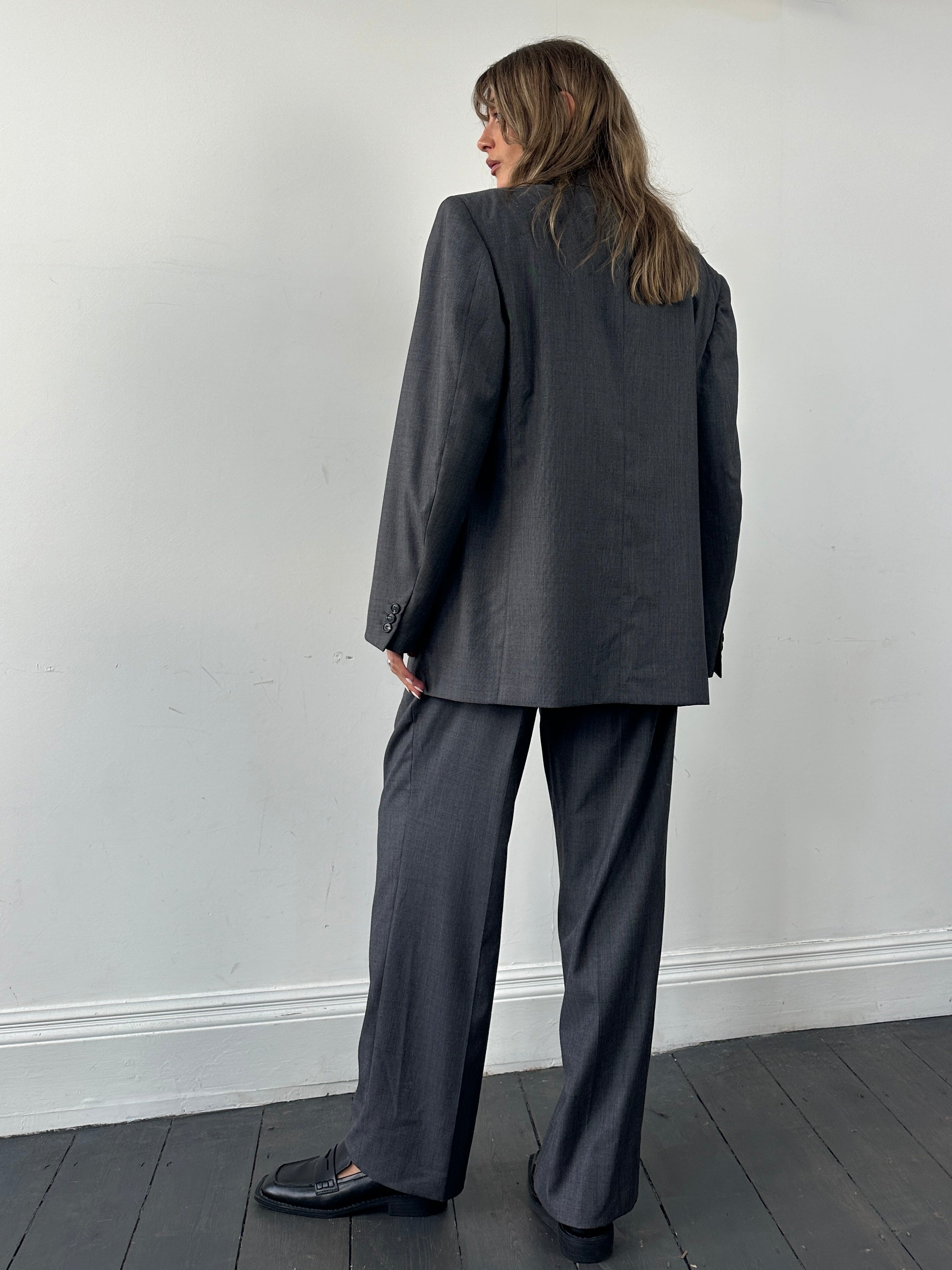 Christian Dior wool double-breasted suit jumpsuit in size 44S/W34, tailored with classic lapels and structured fit.