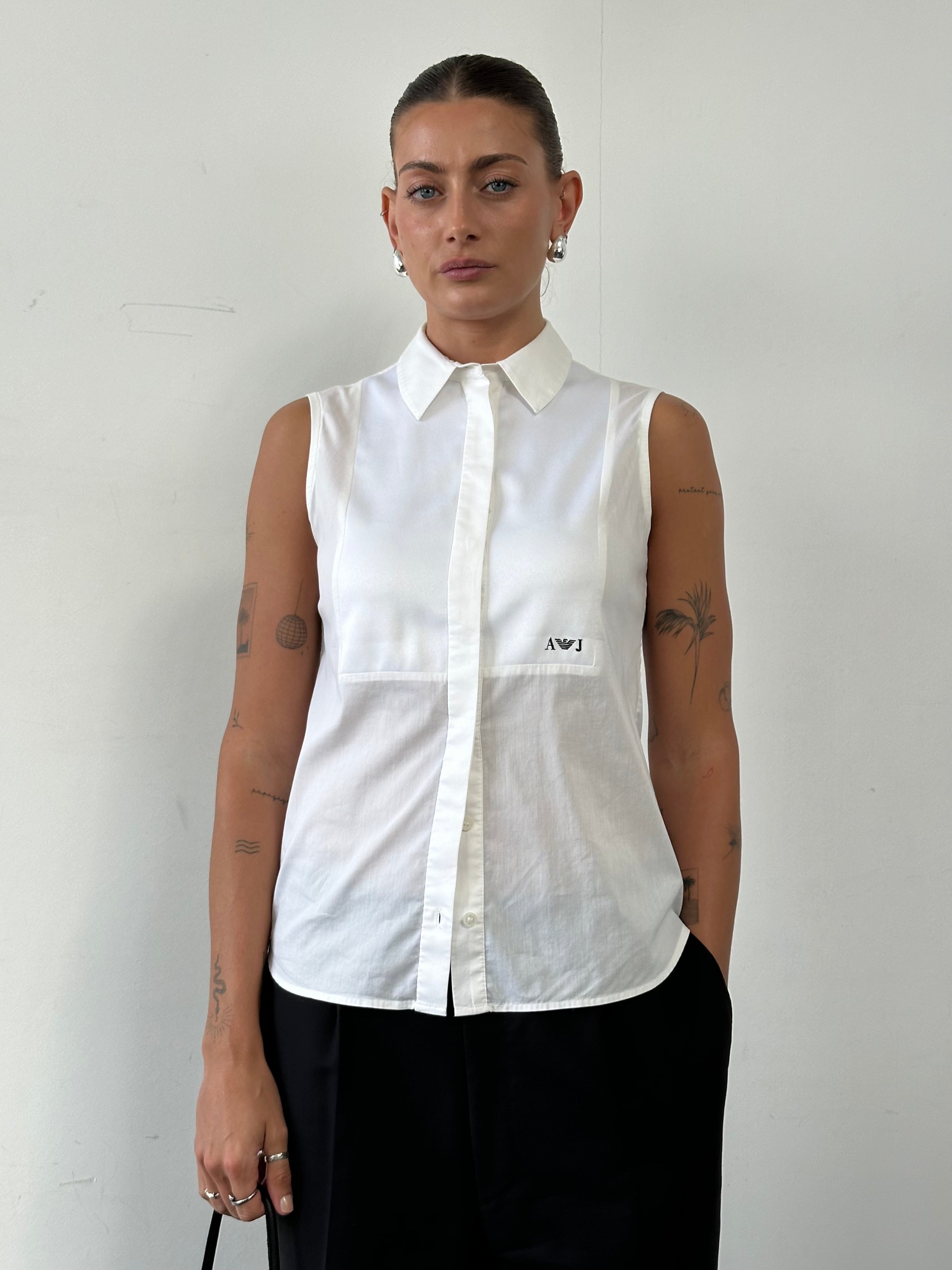 Armani Jeans sleeveless shirt in size S, featuring a lightweight design and classic style, displayed on a hanger.