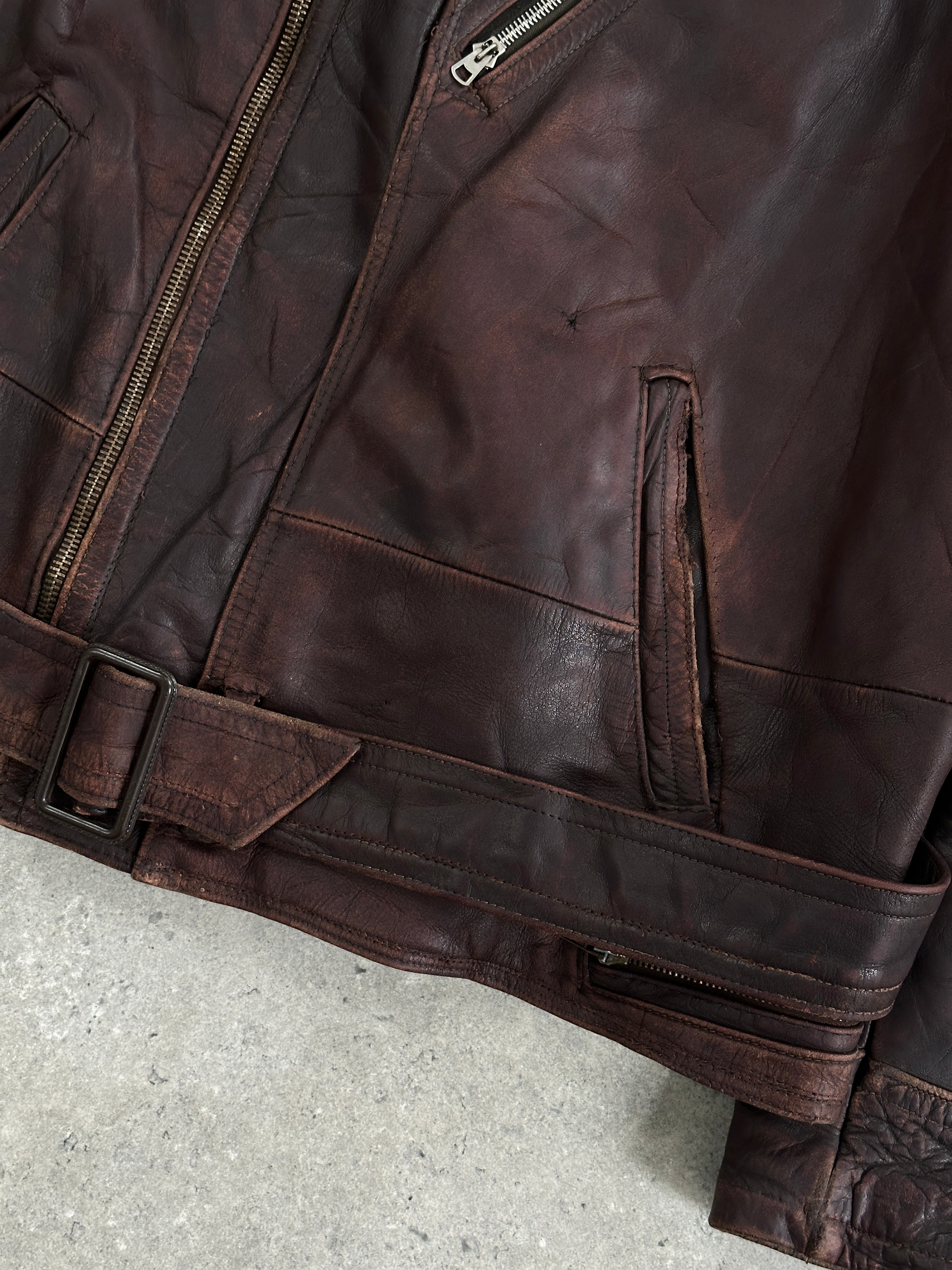 Vintage 1980s distressed leather biker jacket, size large/extra large, with rugged details and classic motorcycle style.