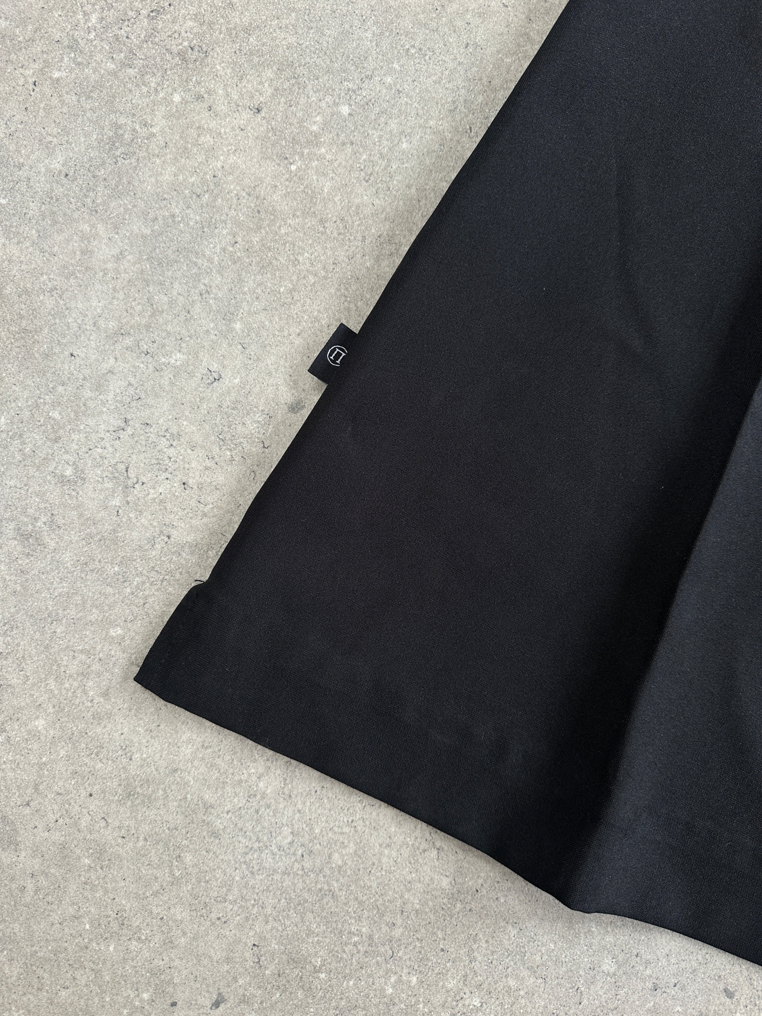 Vintage 1990s flared trousers in W28, showcasing classic retro style with wide leg design and denim fabric.