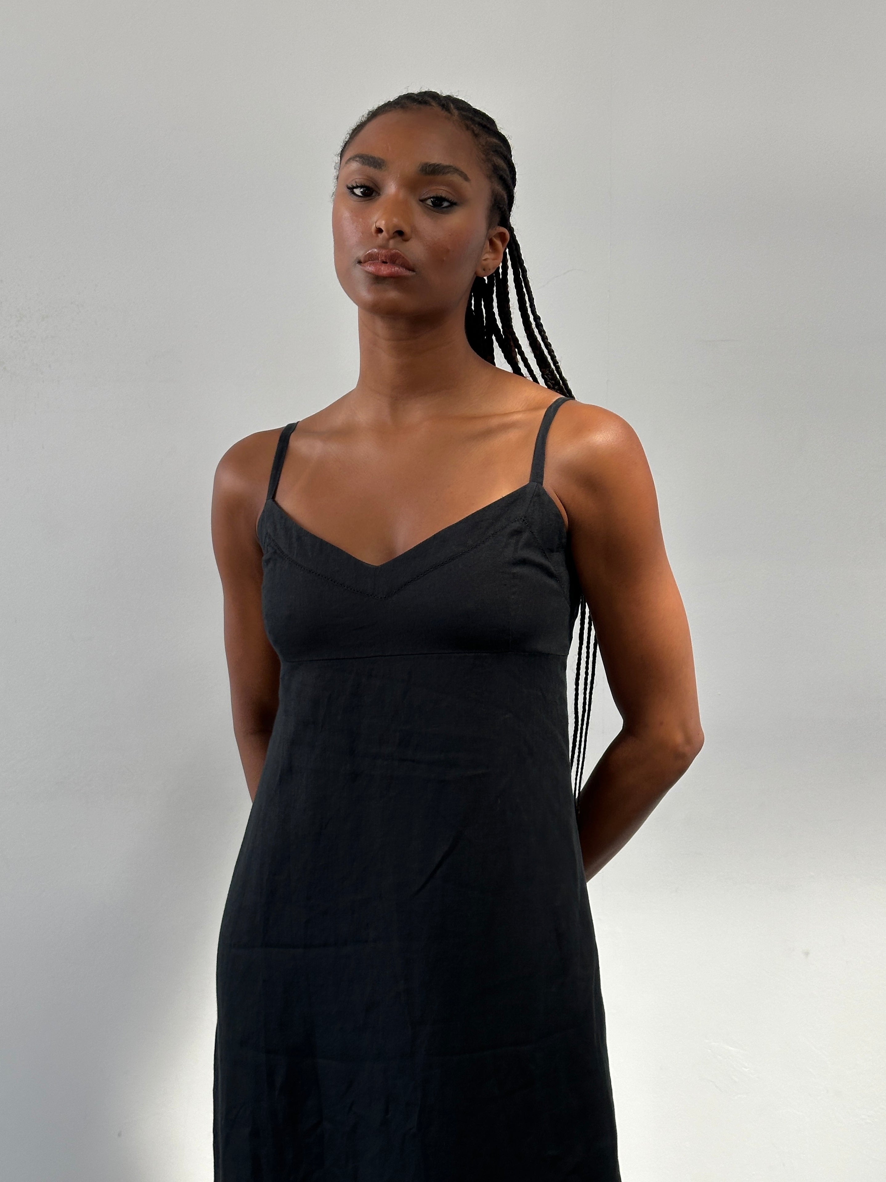 Armani Exchange pure linen maxi dress in size S, featuring a flowing design and elegant neckline, displayed on a hanger.