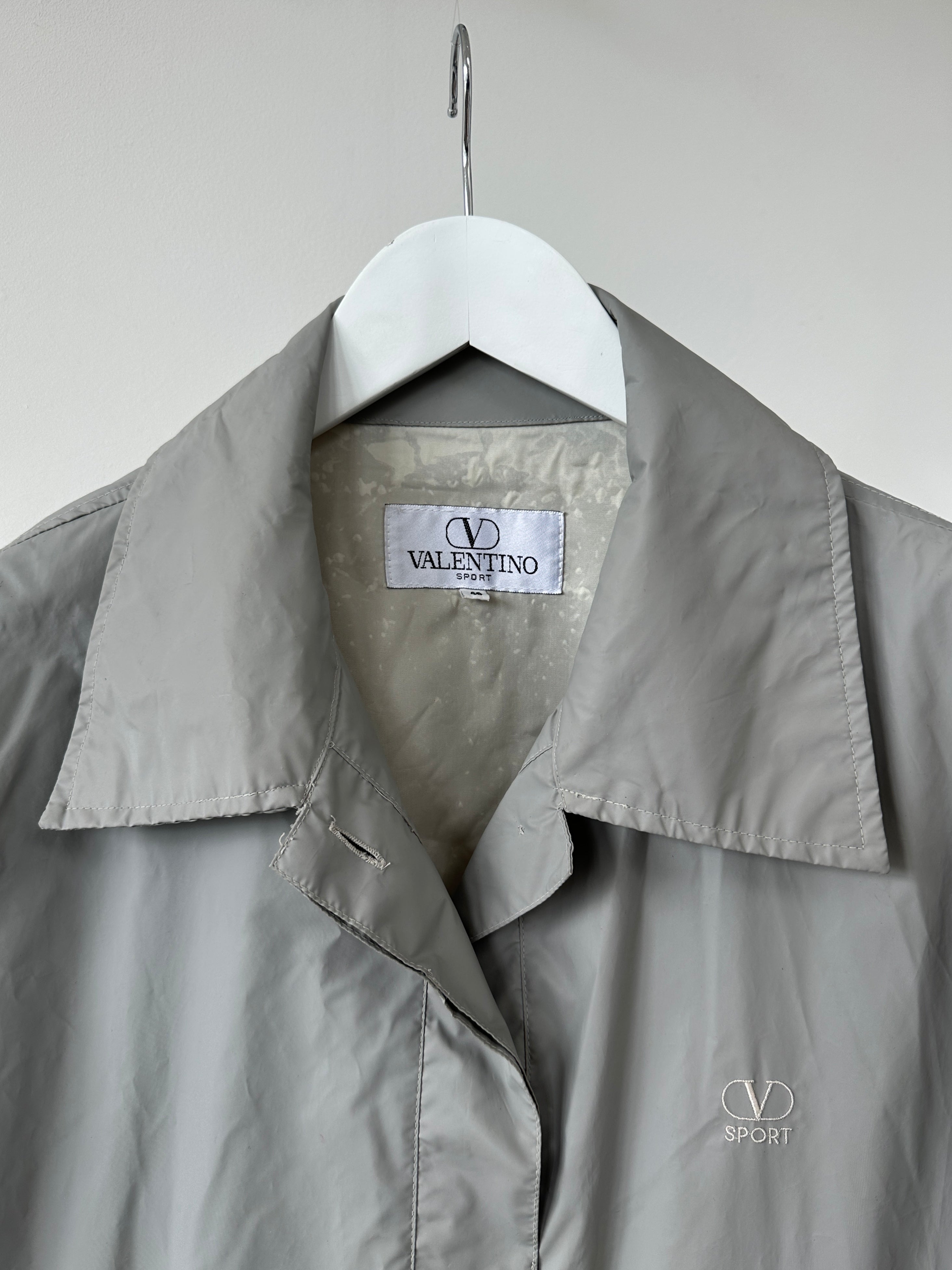 Valentino Sport raincoat jacket in size L, black with sleek design, lightweight waterproof outerwear for active wear.