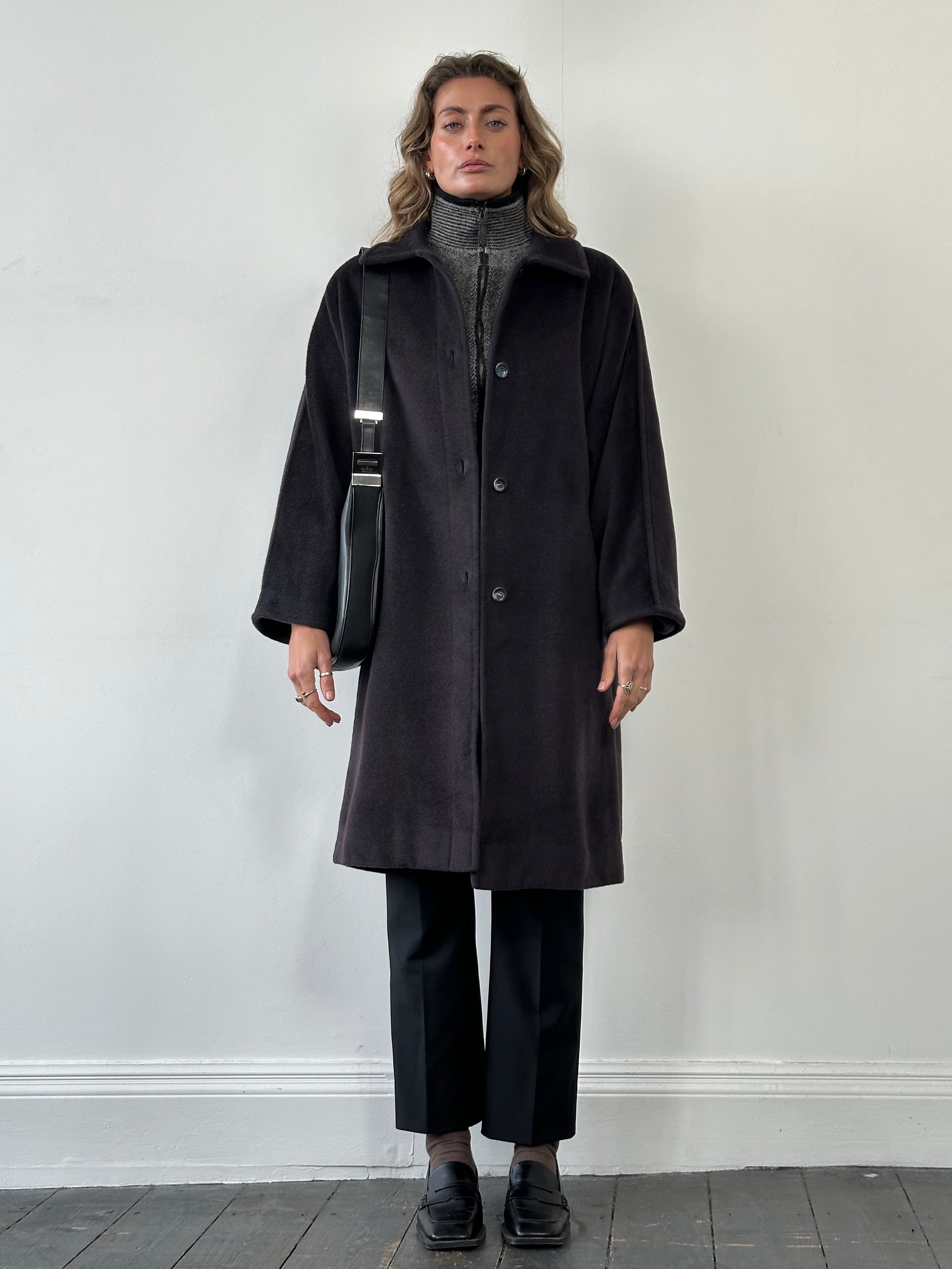 Max Mara wool and cashmere single-breasted coat in size L, displayed on a hanger, showing classic tailored design and neutral color.