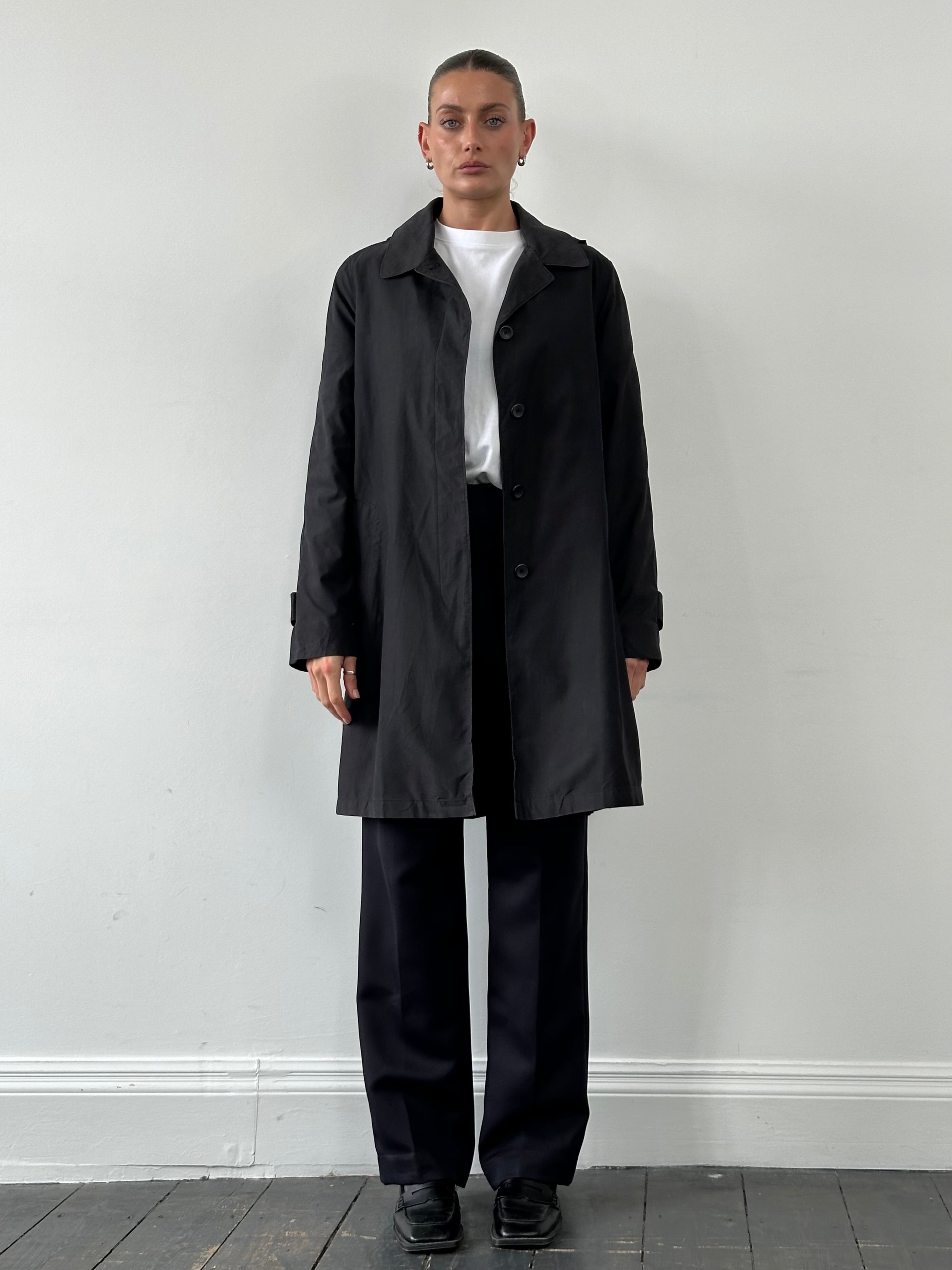 London Fog dark hooded trench coat with concealed placket, front pockets, and adjustable waist in size M.