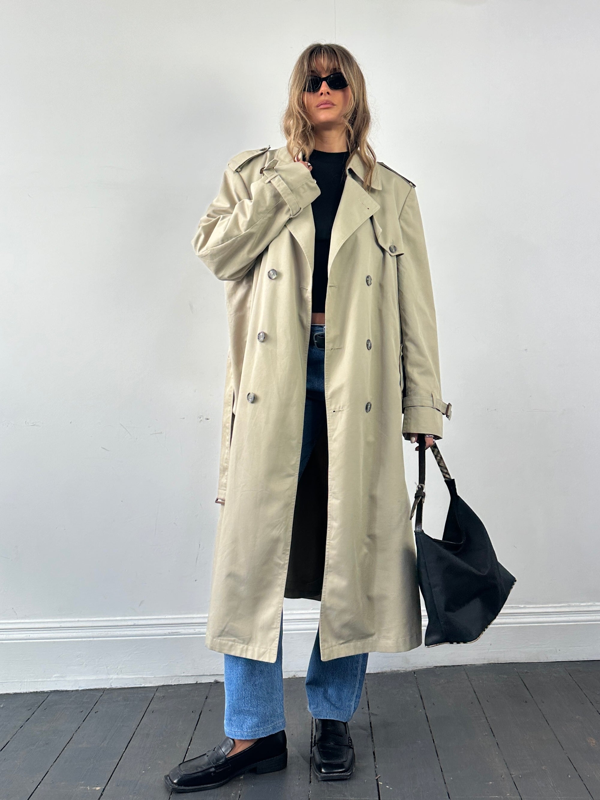 Christian Dior double-breasted belted trench coat in XL, stylish beige coat with classic lapels and waist belt.