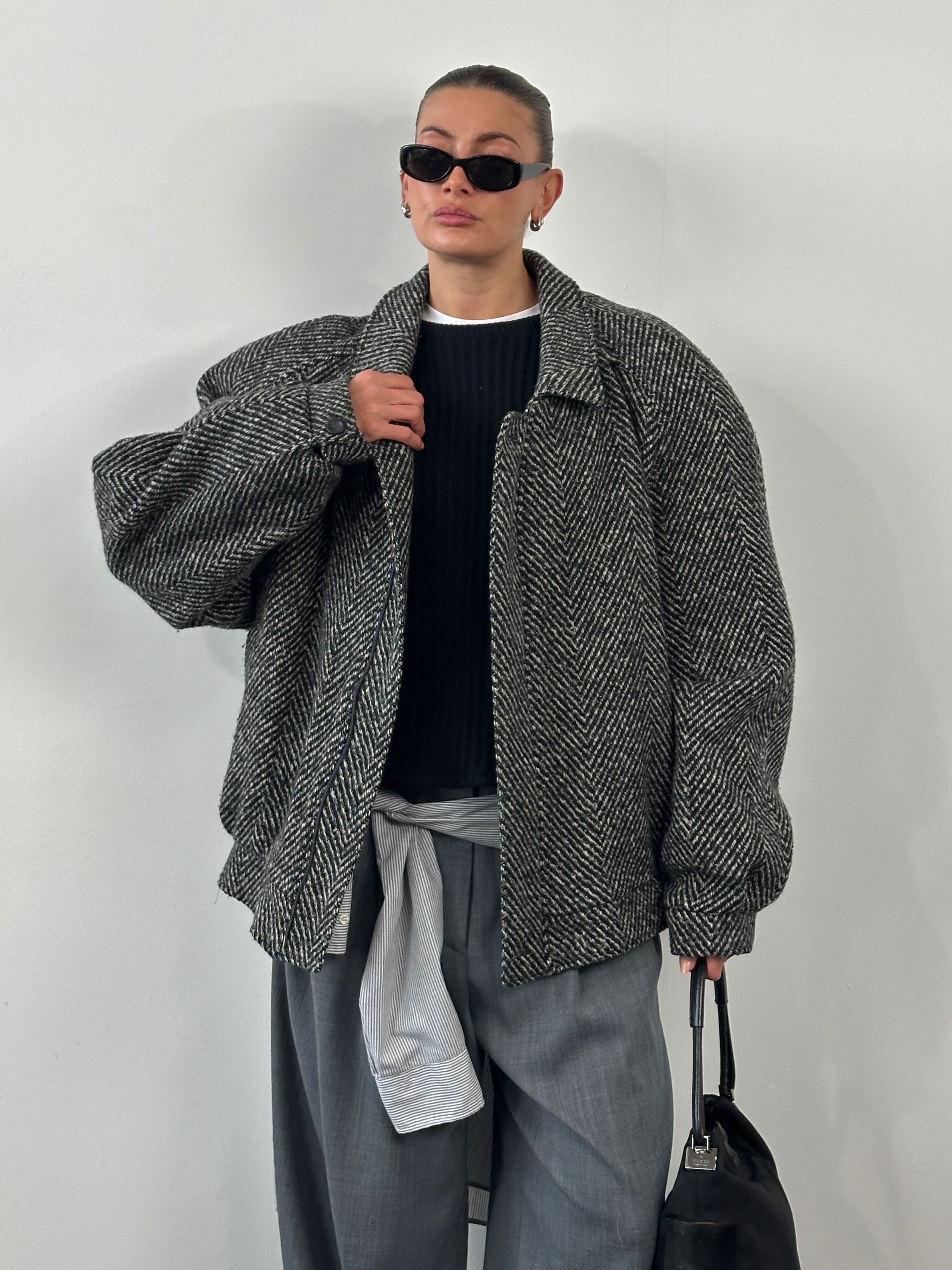 Vintage 1990s wool herringbone bomber jacket in XXL, featuring classic style and textured fabric, displayed on a hanger.