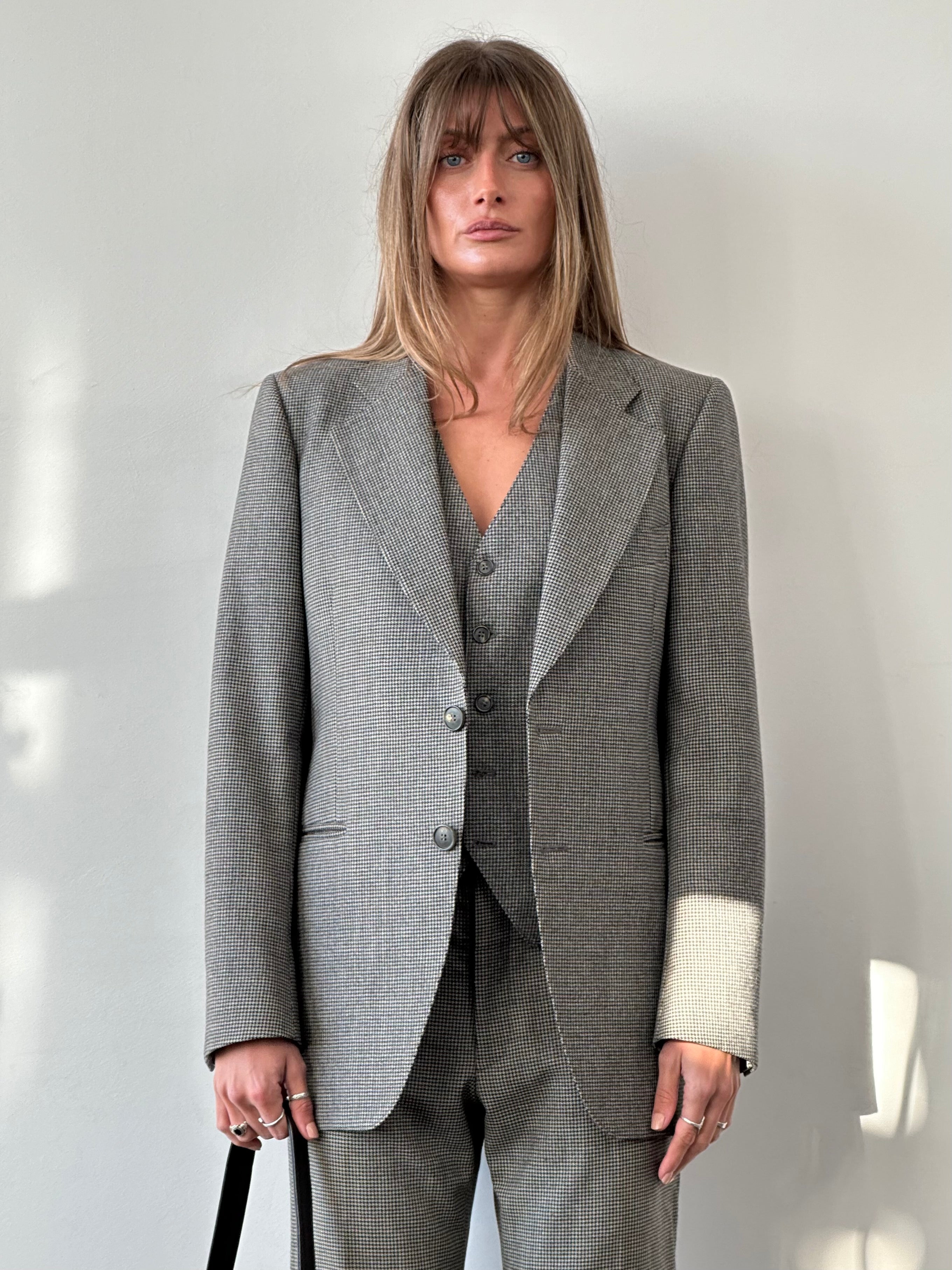 Vintage Italian vintage pure wool houndstooth three-piece suit in size 38R/W31, showing the jacket, vest, and trousers.