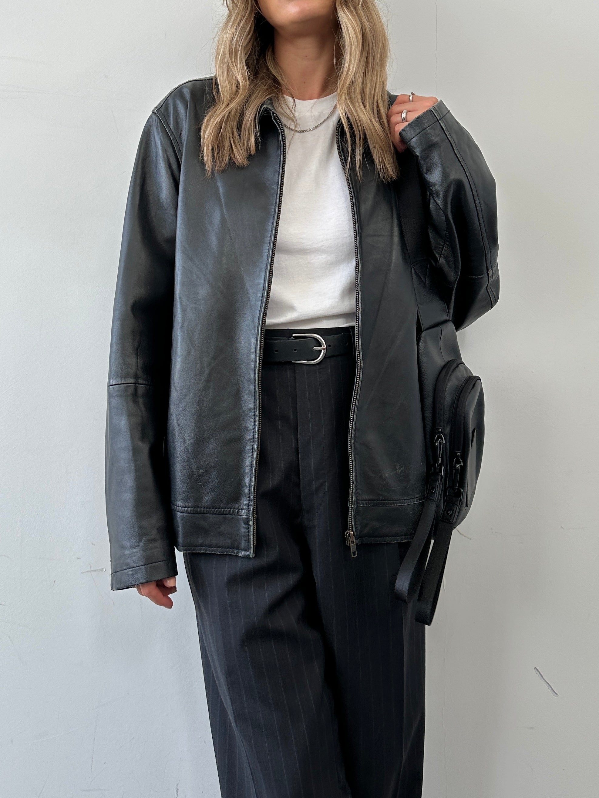 Conbipel minimal leather jacket in size L, featuring a sleek design with smooth leather and clean lines.